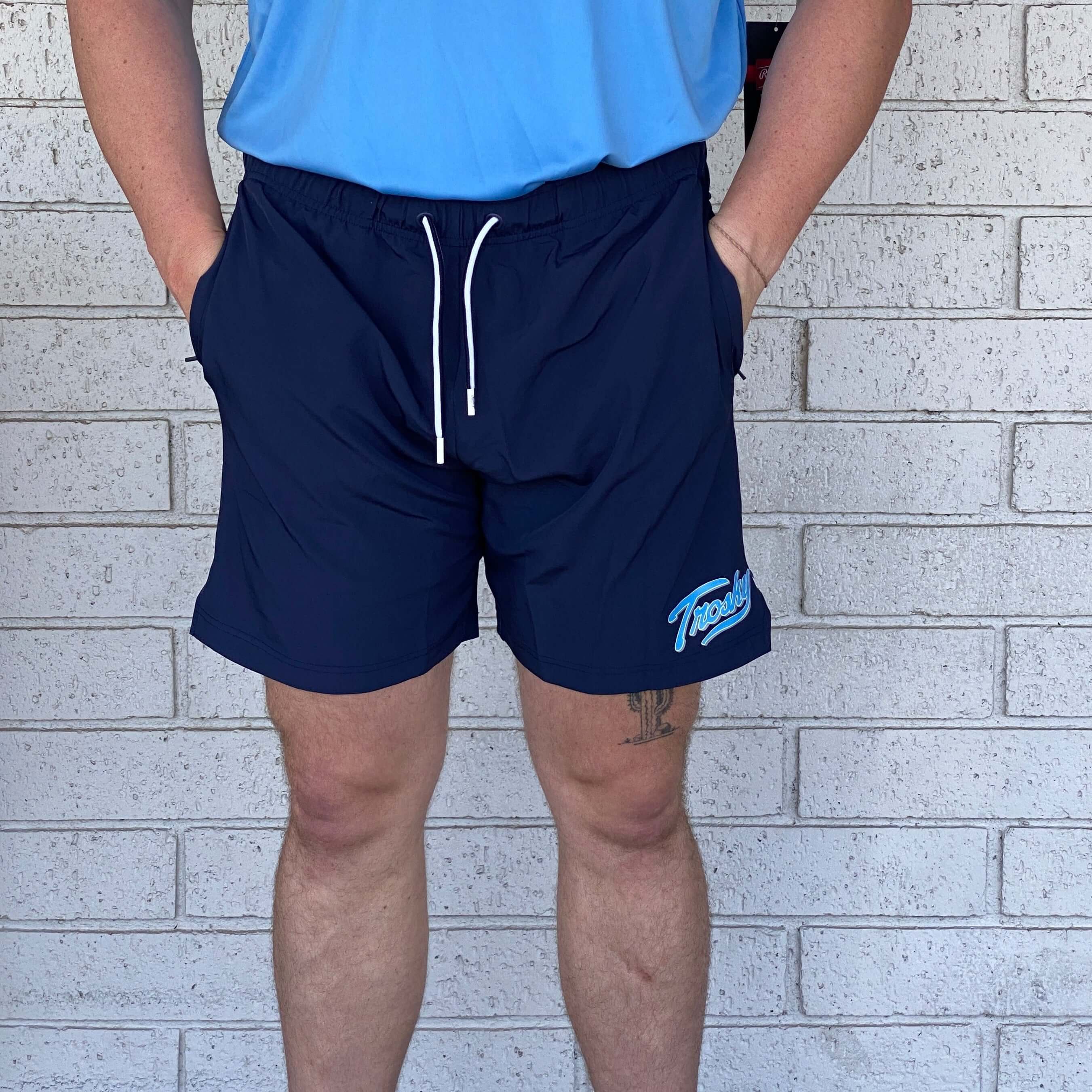 Rawlings Trosky Shorts in navy with pockets, showcasing a contemporary athletic fit for active lifestyles.
