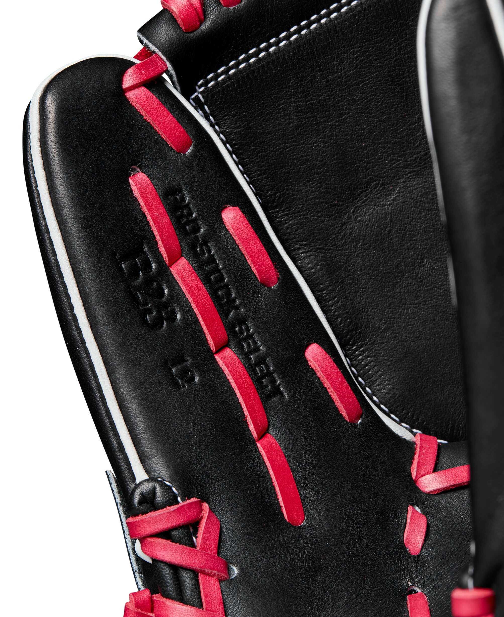 Wilson A2K B23 pitcher's glove interior view featuring black leather and pink accents for optimal performance and style.