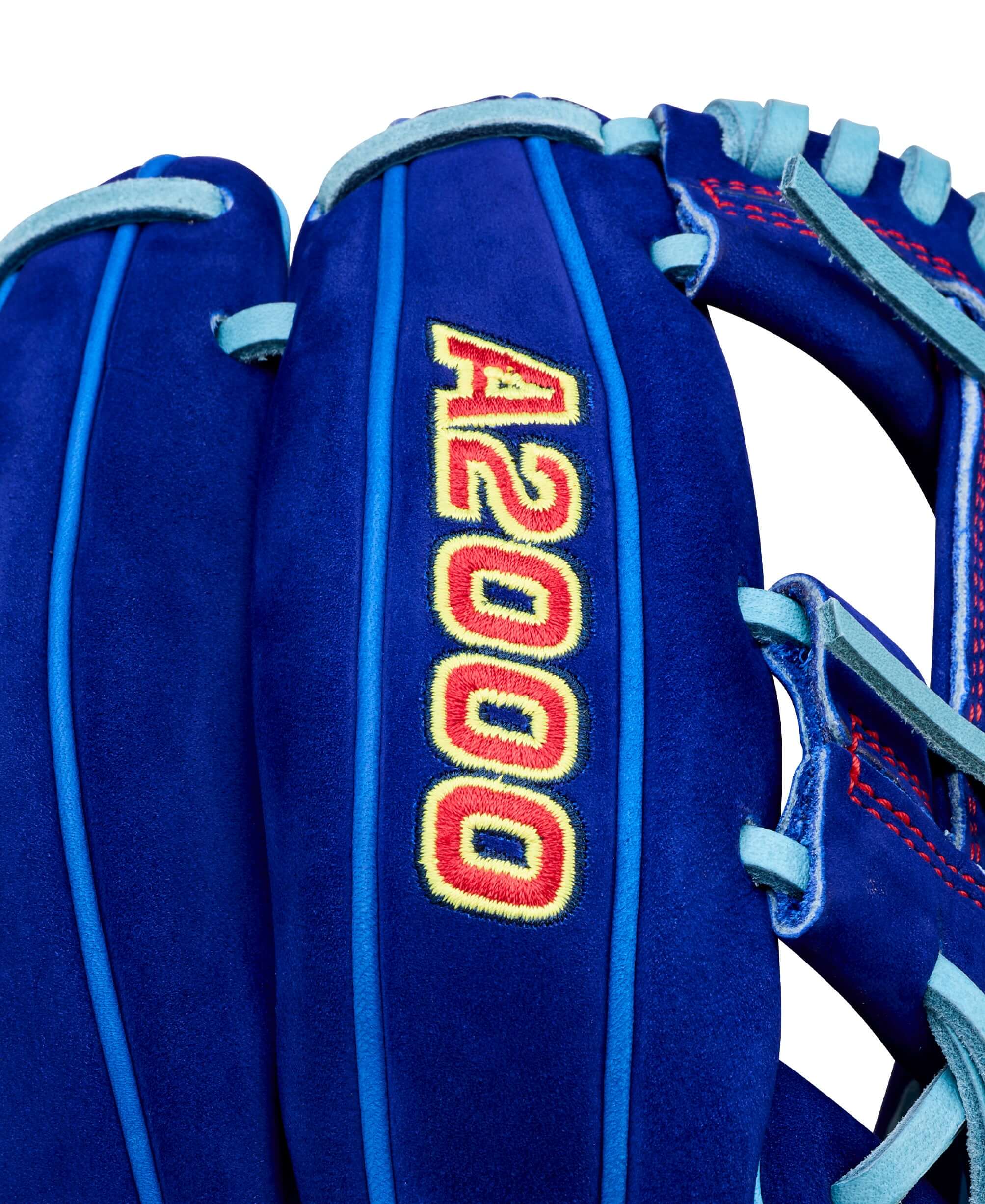 Web detail of Wilson Big Rally Blue Raspberry A2000 1786 11.5" Infield Baseball Glove, showcasing red A2000 stitching on blue leather.