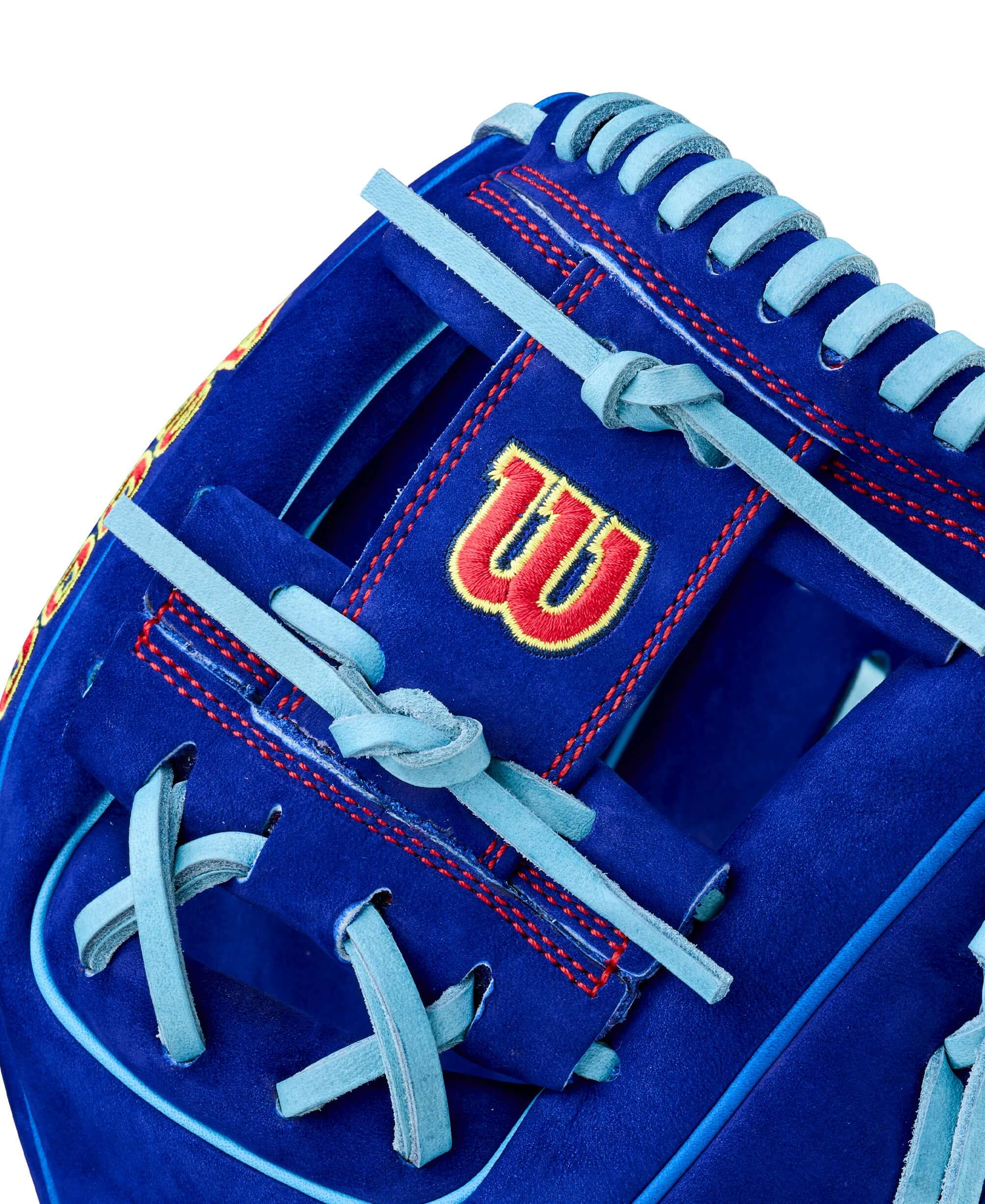 Close-up of Wilson Big Rally Blue Raspberry A2000 1786 glove webbing with red stitching and blue lacing.