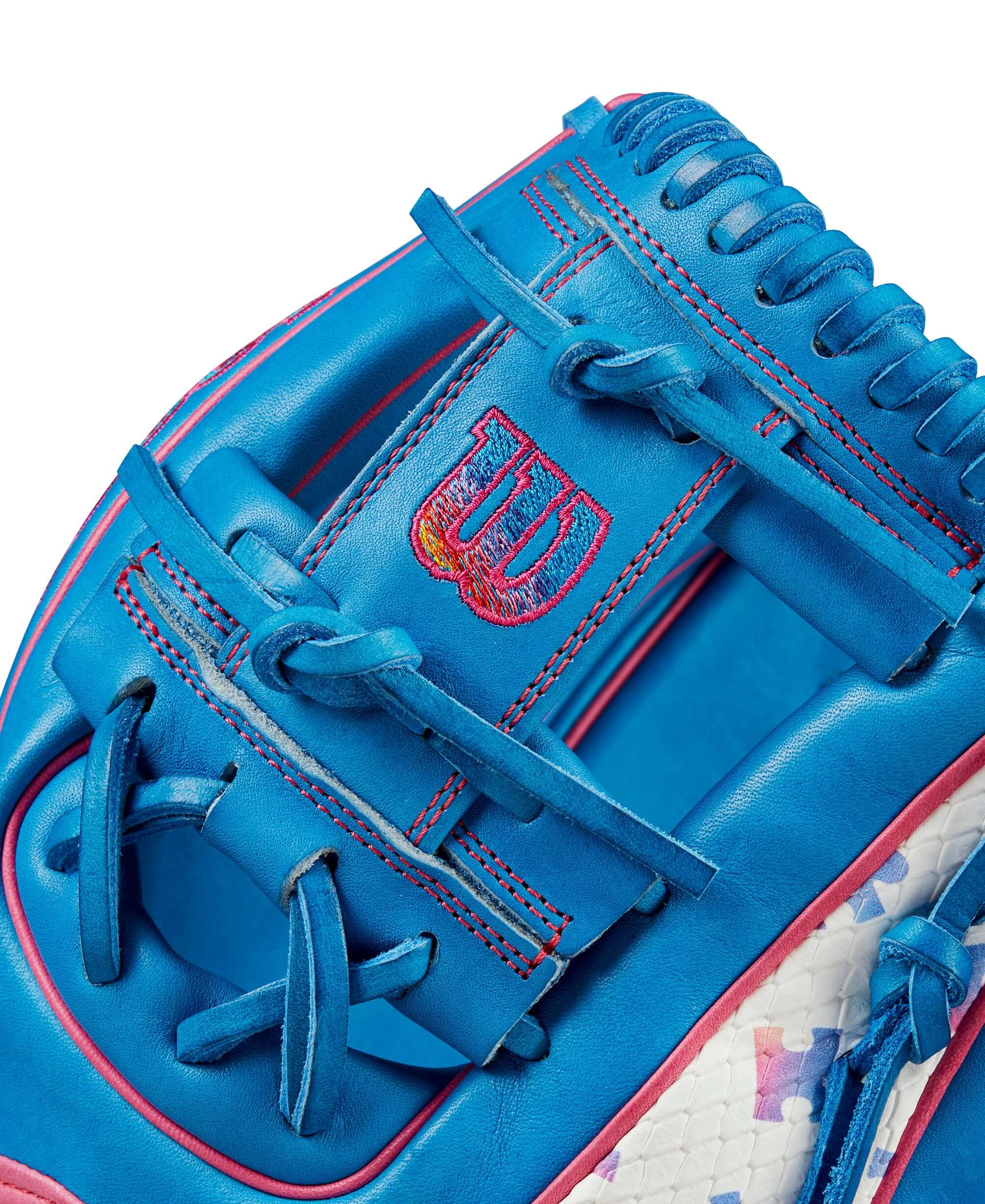 Close-up of the Wilson 2024 Autism Speaks A2000 infield baseball glove showcasing vibrant blue leather and unique design details.