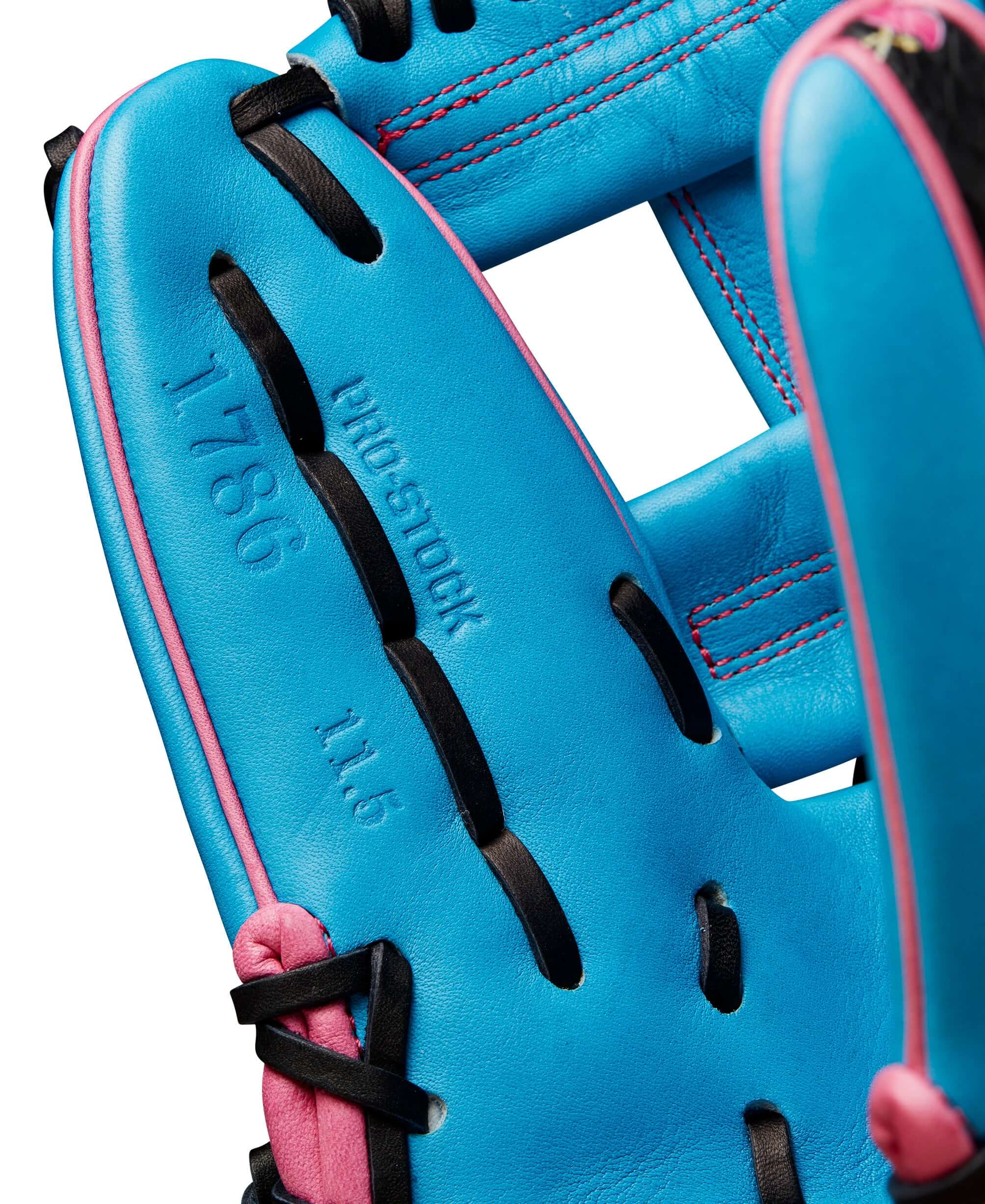 Close-up of Wilson A2000 1786 glove interior, showing tropical blue leather and pink accents. Ideal for baseball infielders.