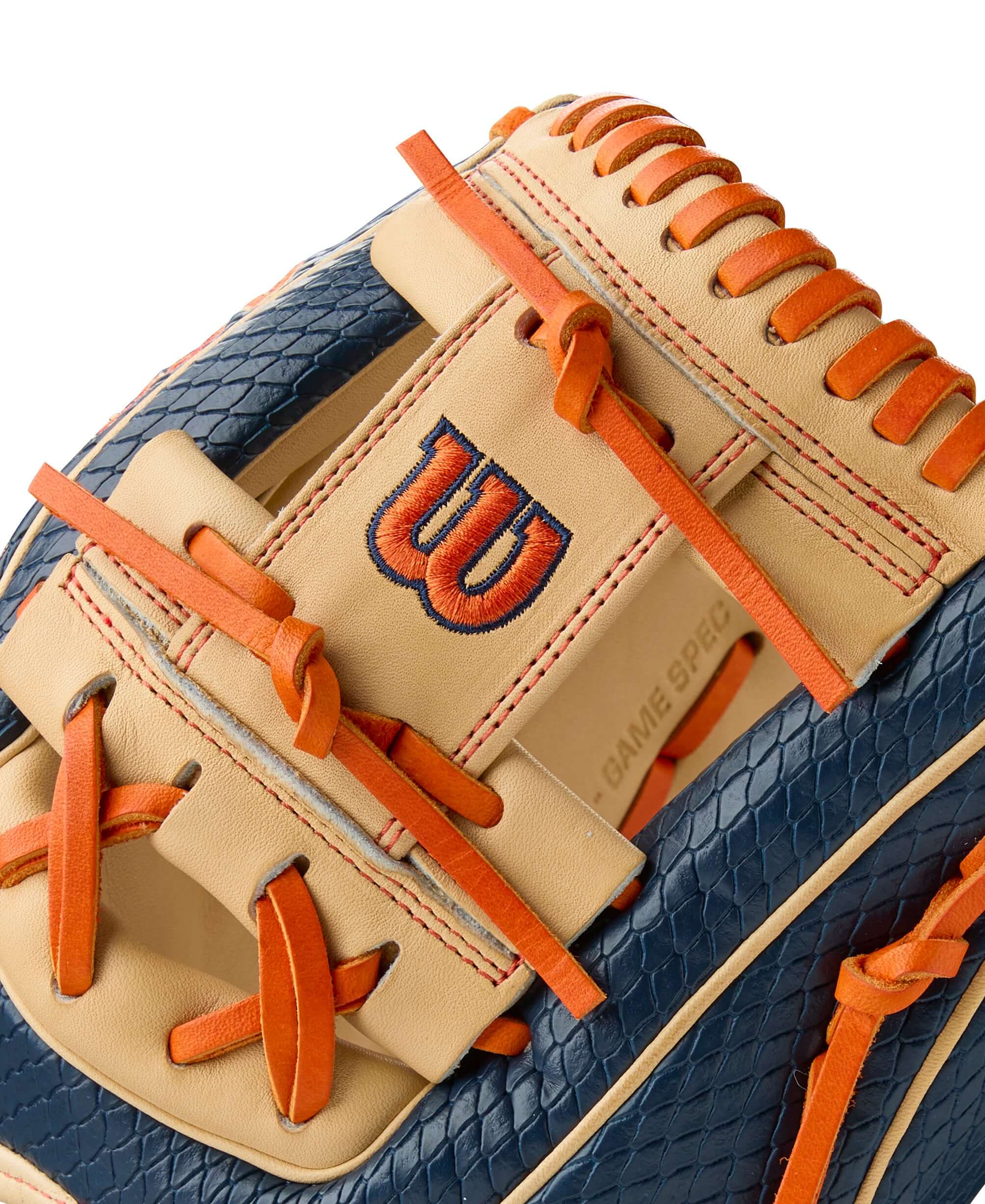 Close-up of Wilson A2000 Jose Altuve baseball glove featuring navy, blonde, and orange details for optimal infield play.