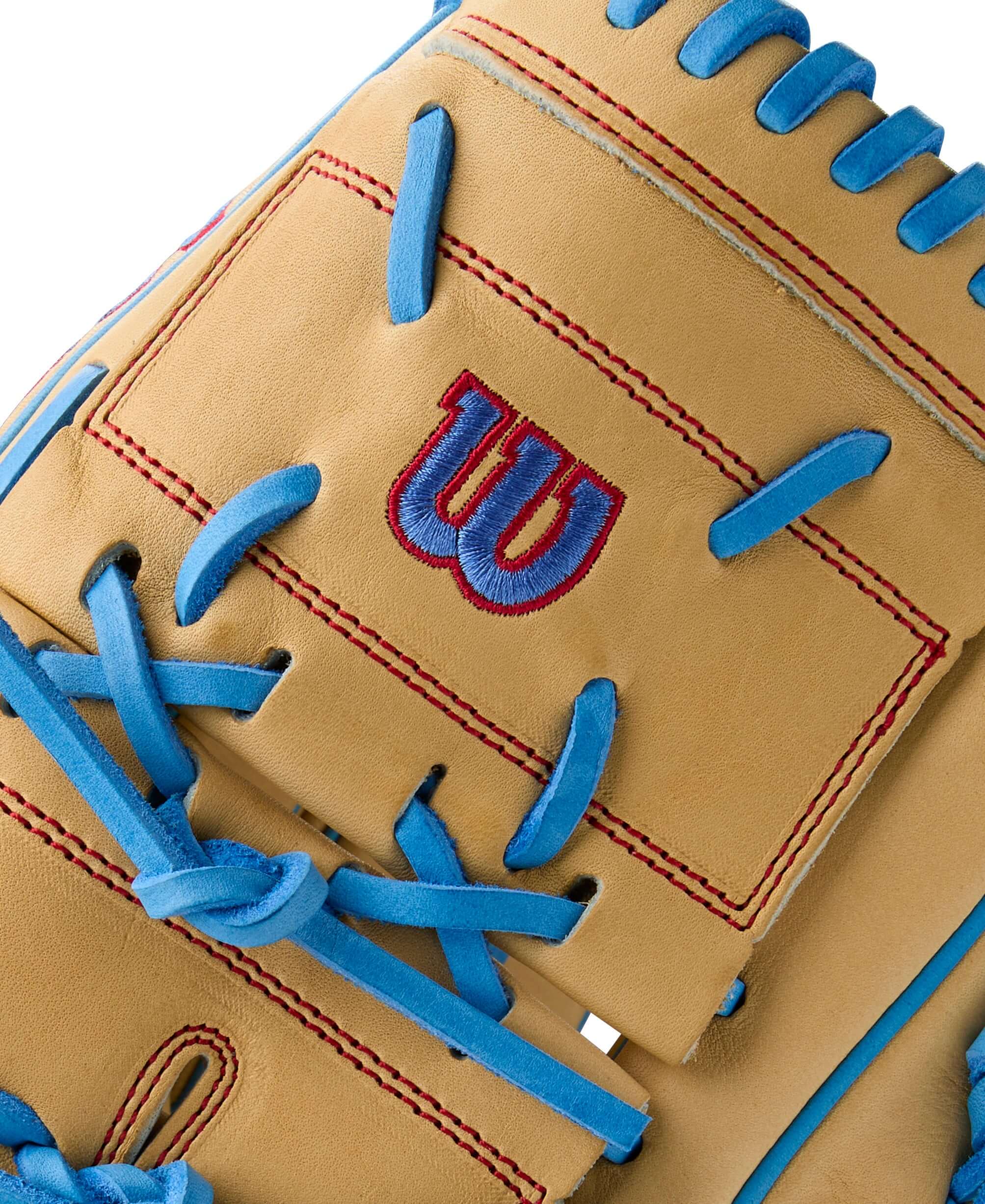 Close-up of Wilson A2000 B125 glove in blonde leather with sky blue and red accents.