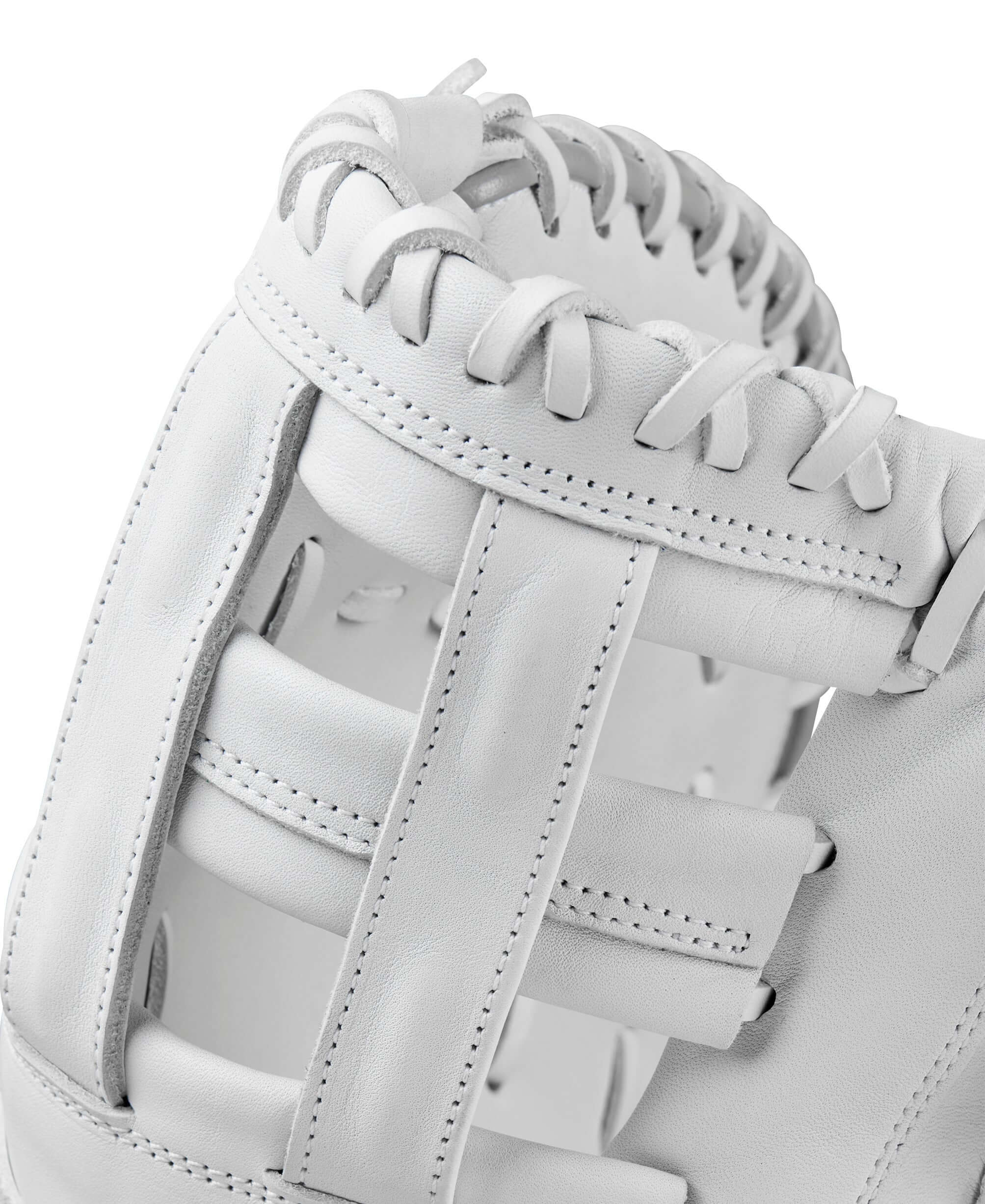 Close-up view of the Wilson A1000 1620 Fastpitch Softball Gloves showcasing the white leather craftsmanship.