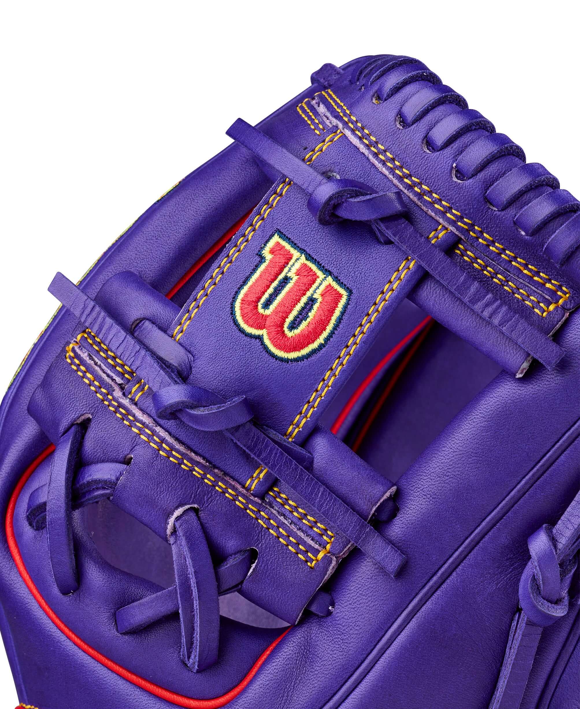 Wilson Ground Ball Grape A2000 1786 glove web detail with dual lacing and red stitching.