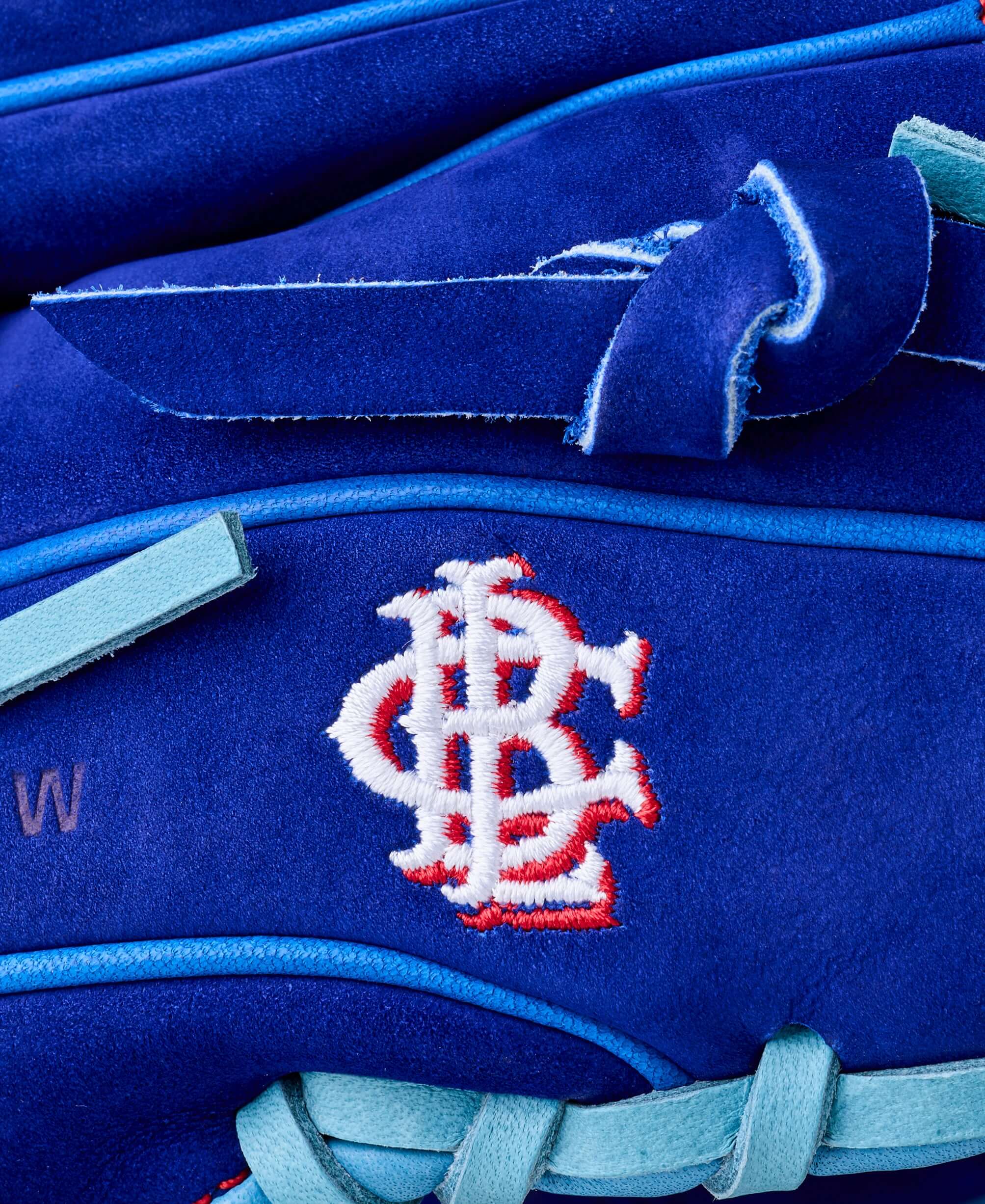 Close-up of Wilson Big Rally Blue Raspberry A2000 1786 glove showing logo embroidery and blue leather detail.