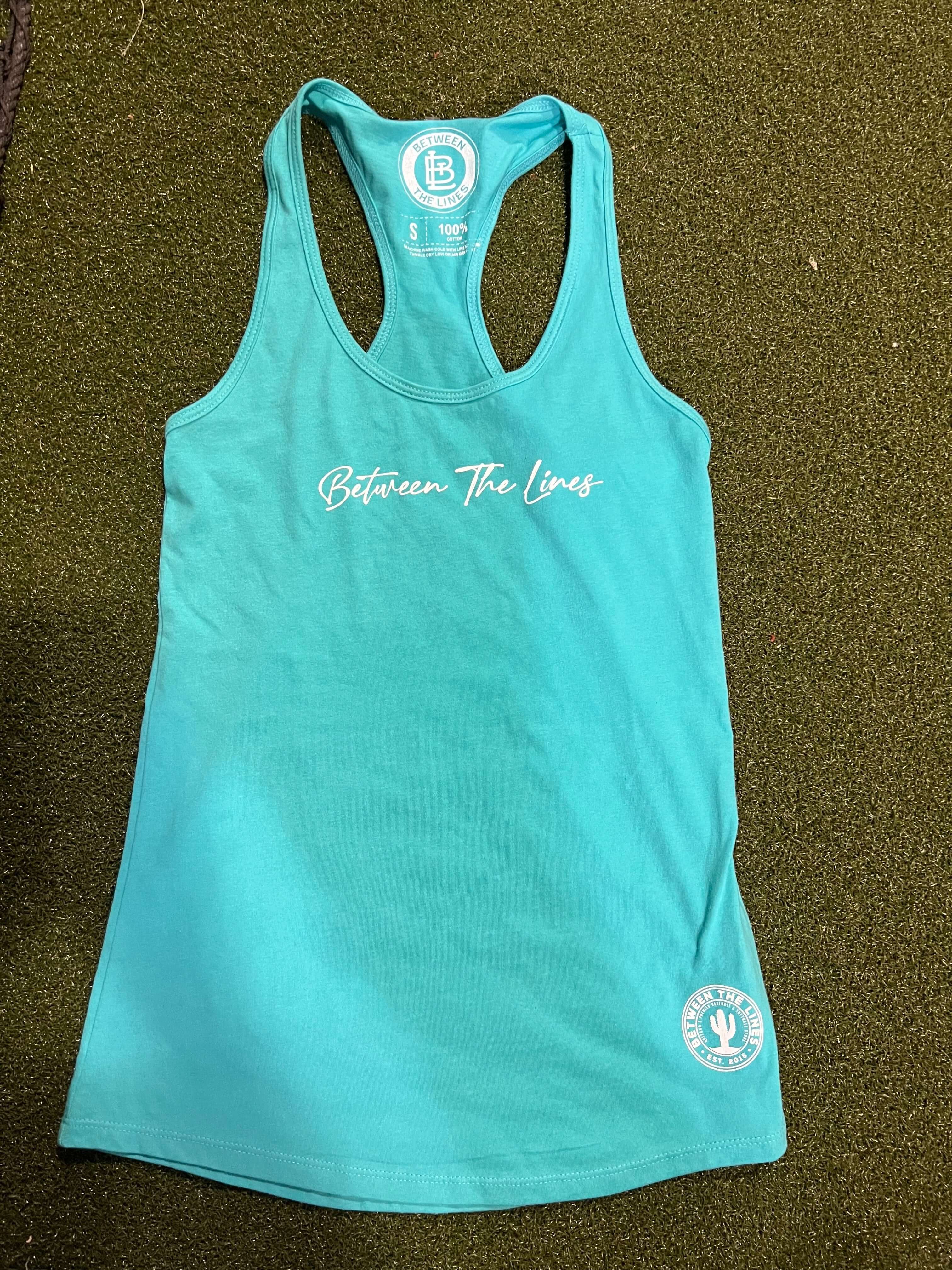 Between The Lines Racerback Women's T-Shirt in turquoise color, showcasing trendy design and comfortable fit.