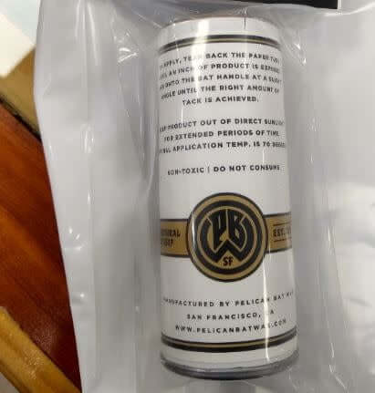 Pelican Bat Wax The Stick Pine Tar Brown in a tear-away paper tube