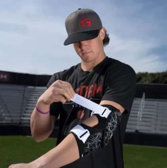 G-Form Elite 2 Batter Elbow Guard with SmartFlex padding, flexible during play, hardens on impact.