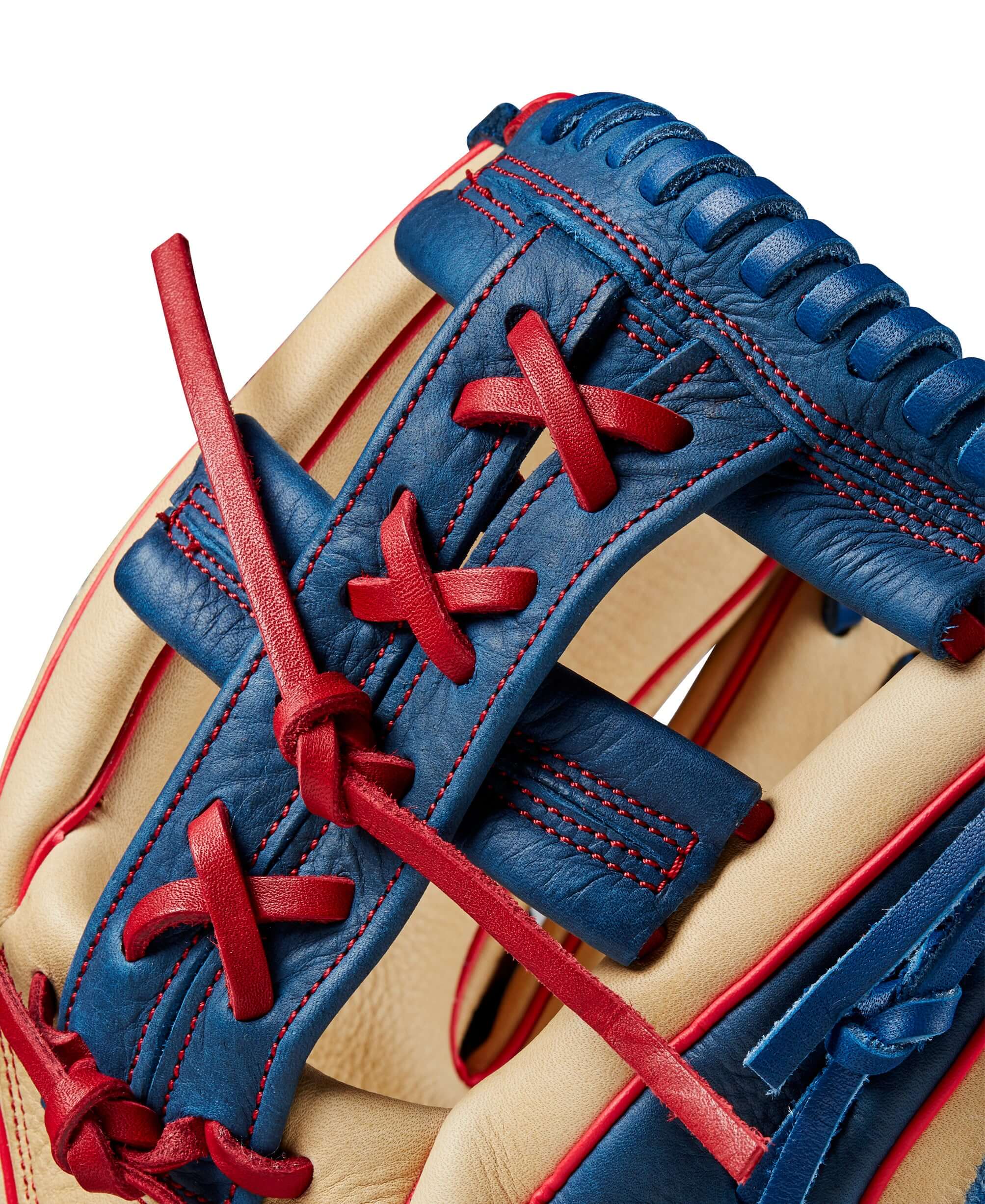 Close-up of Wilson 2024 A1000 1912 infield baseball glove, showcasing blue and red leather lacing and craftsmanship details.