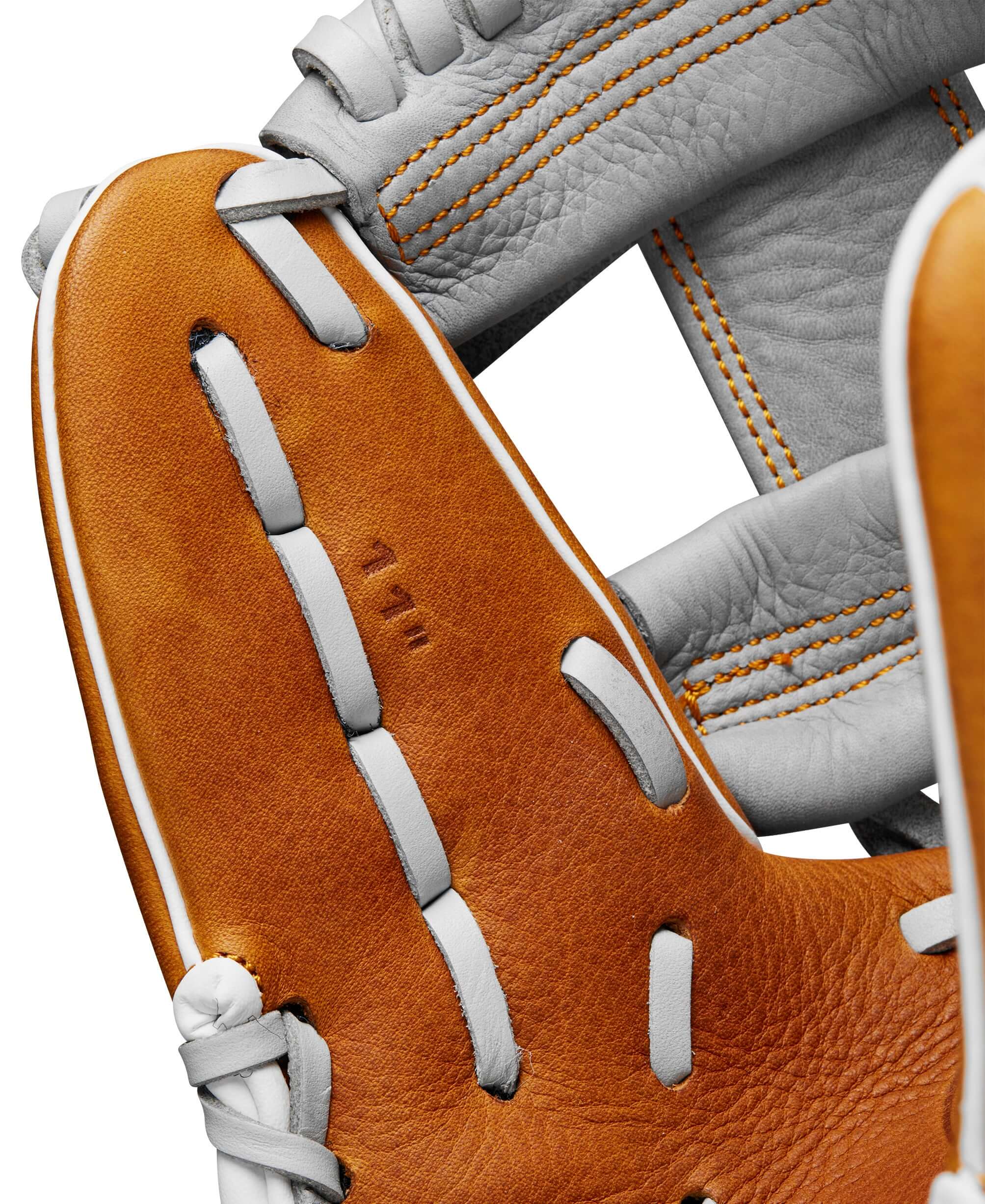 Close-up of the Wilson 2024 A1000 PF11 infield baseball glove showcasing its 11” full grain leather design and stitching details.