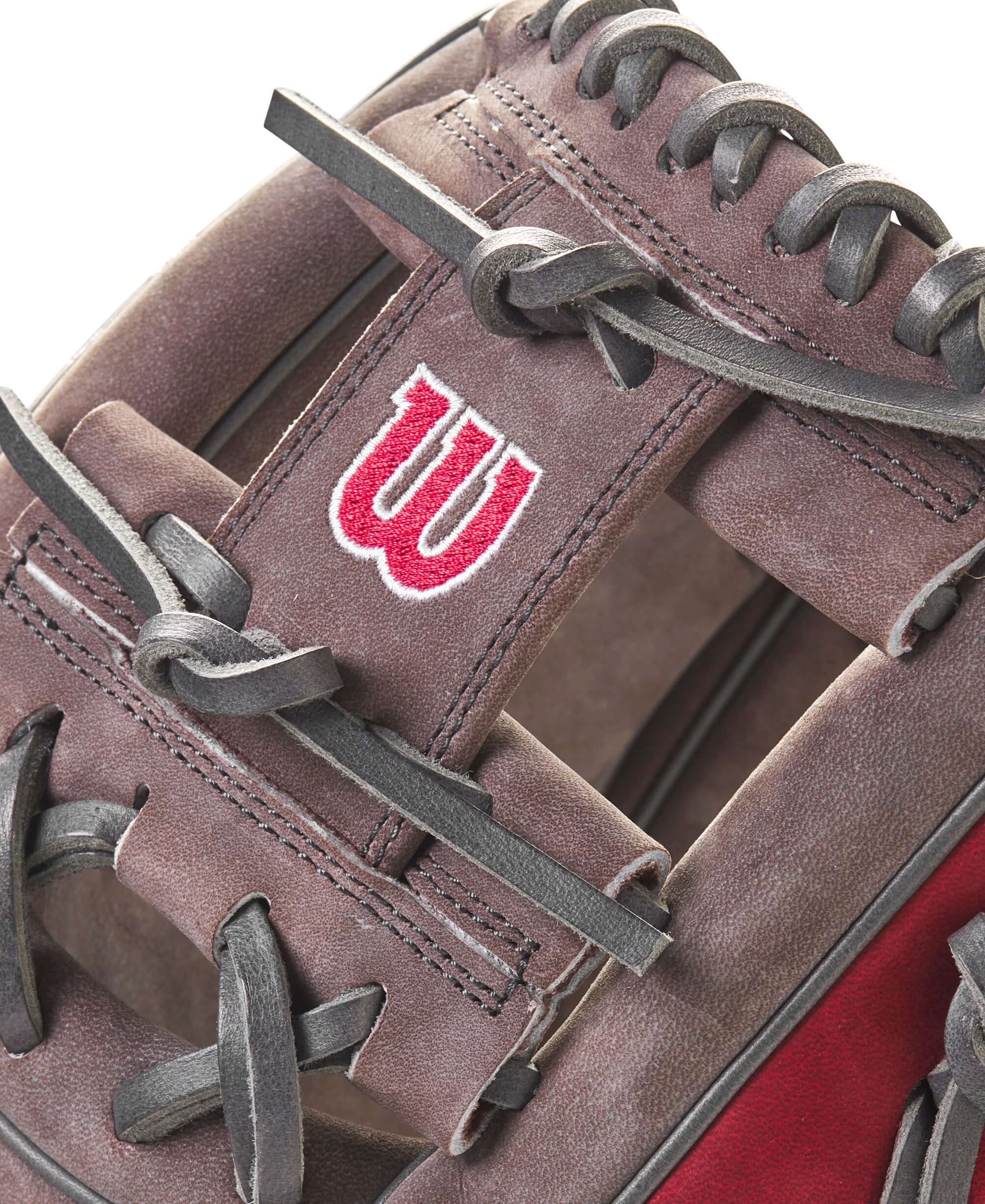Close-up of Wilson A2000 GOTM December 2023 glove showcasing the buffed Coal and Red Pro Stock® leather and H-Web design.
