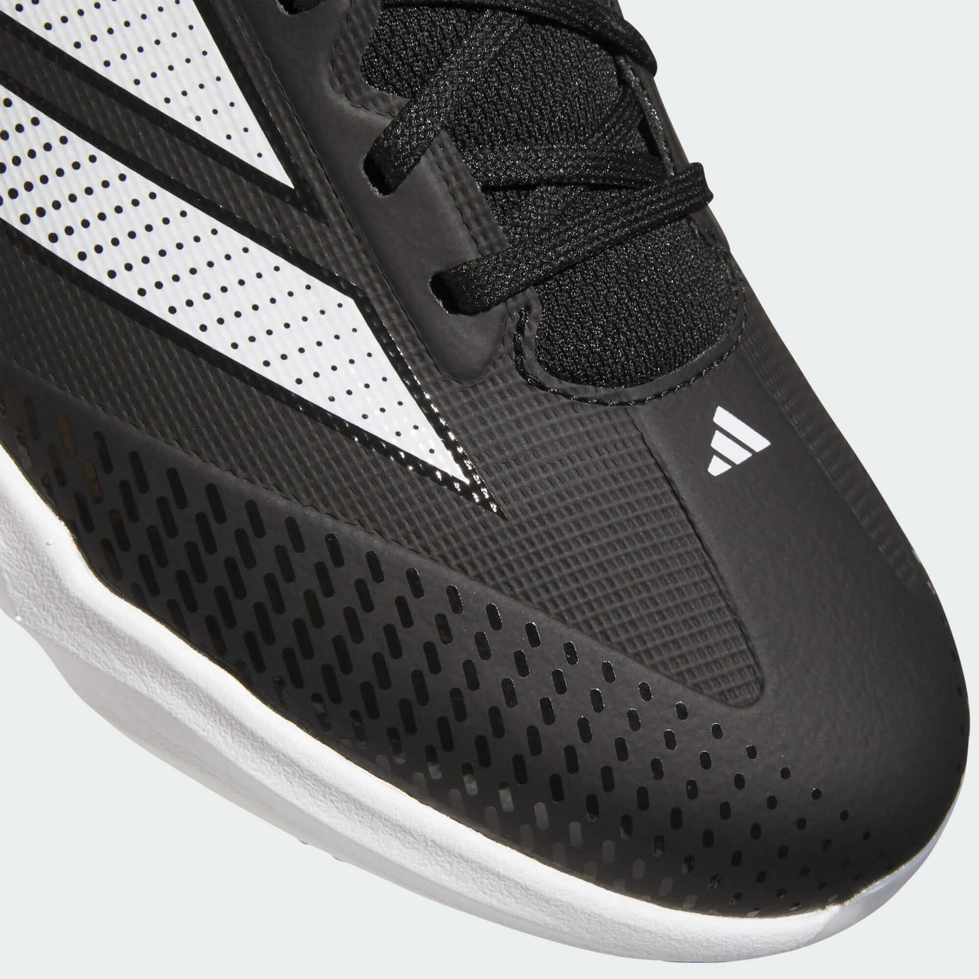Close-up of toe cap with logo on Adidas Adizero Impact 2.0 TPU Cleats - Core Black/Cloud White, showing texture and lacing detail.