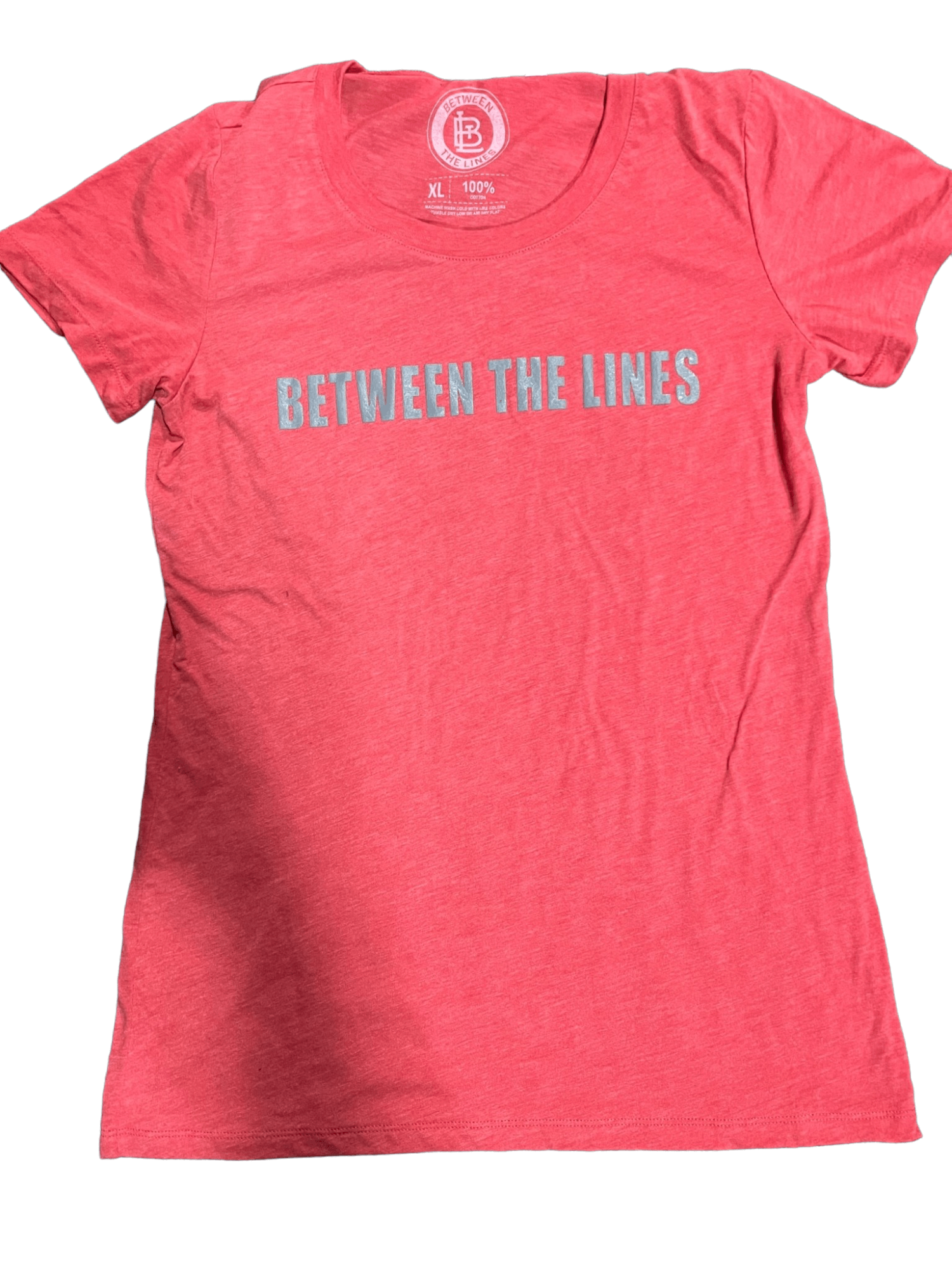 Between The Lines women's cactus t-shirt in coral, featuring a round neckline and stylish graphic print.