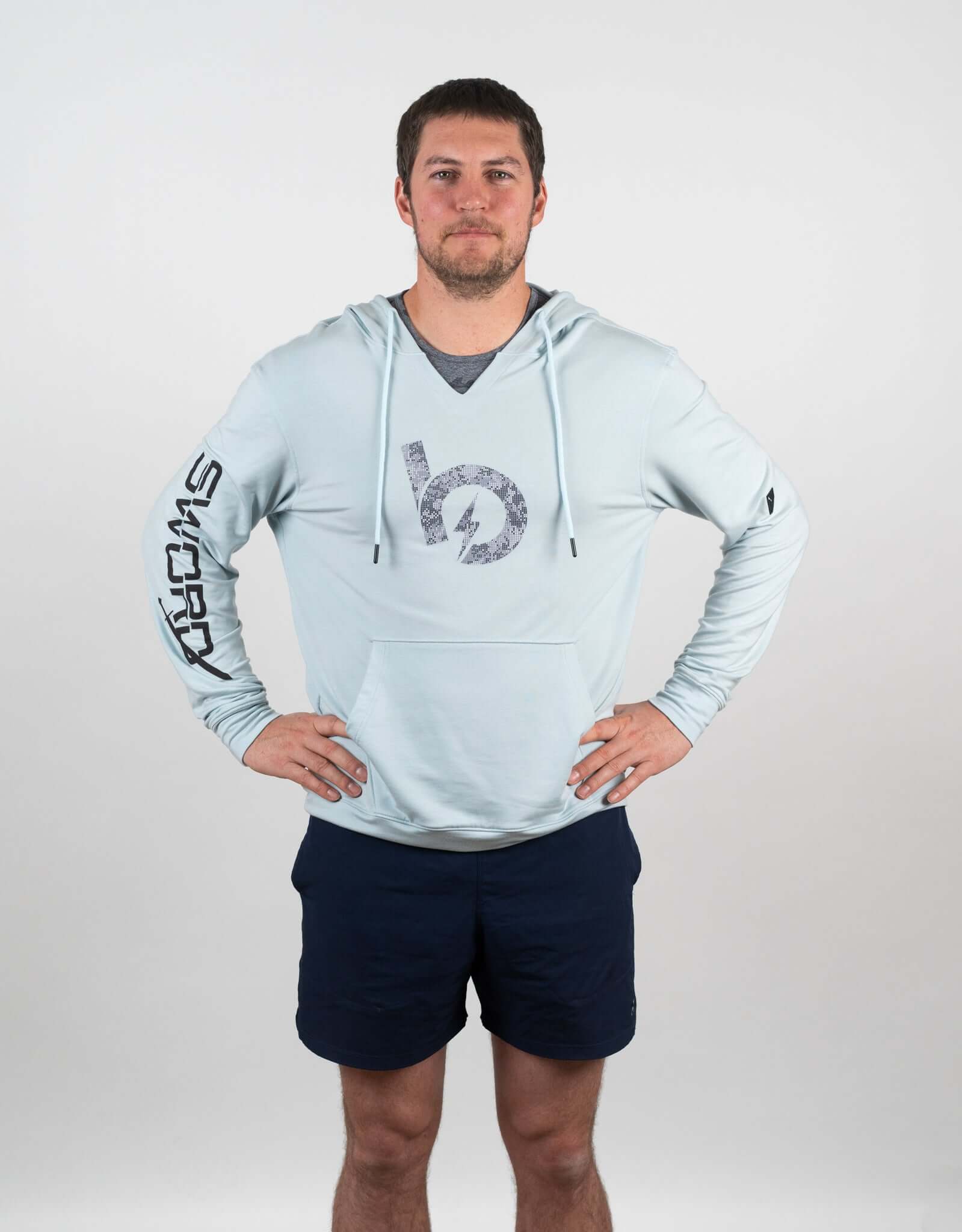 Model wearing a light blue Bauer Outage Lightweight Hoodie with stylish design and comfortable fit.