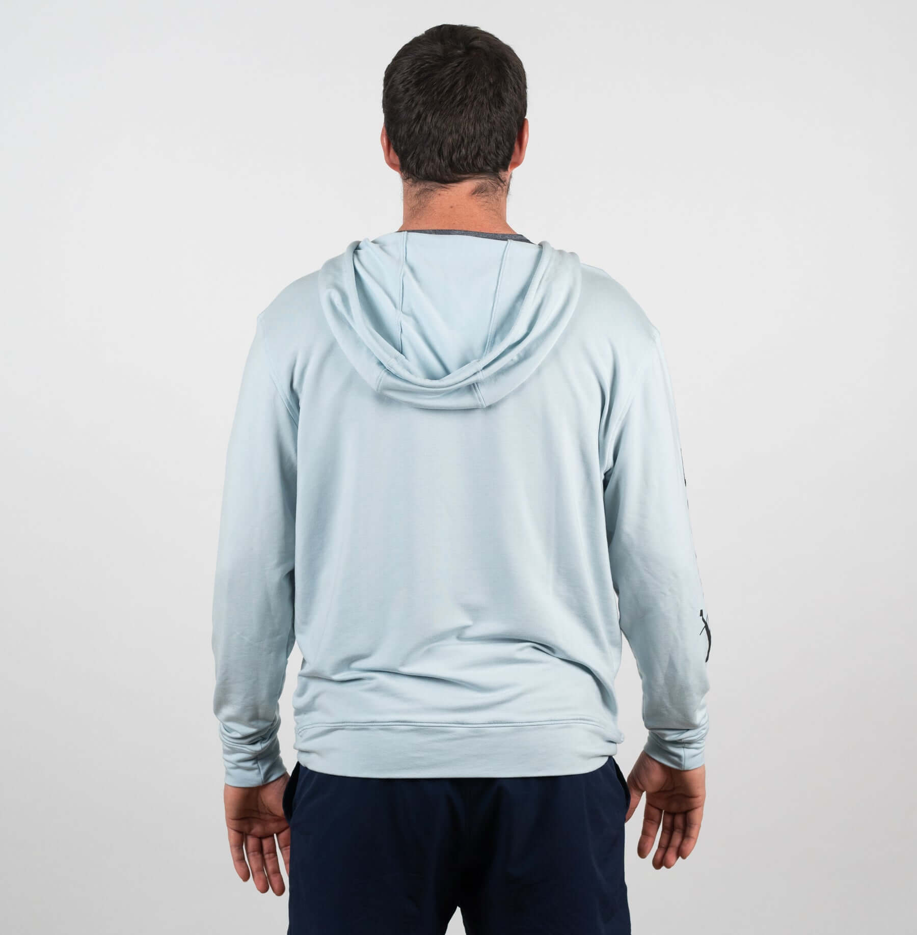 Back view of the Bauer Outage Blue Lightweight Hoodie, featuring a relaxed fit and stylish notch-neck collar.