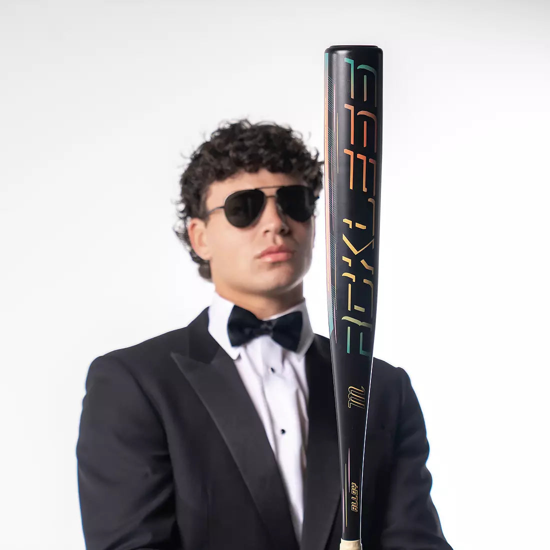 Man in tuxedo holding Marucci RCKLESS GEN 2 (-3) BBCOR Baseball Bat