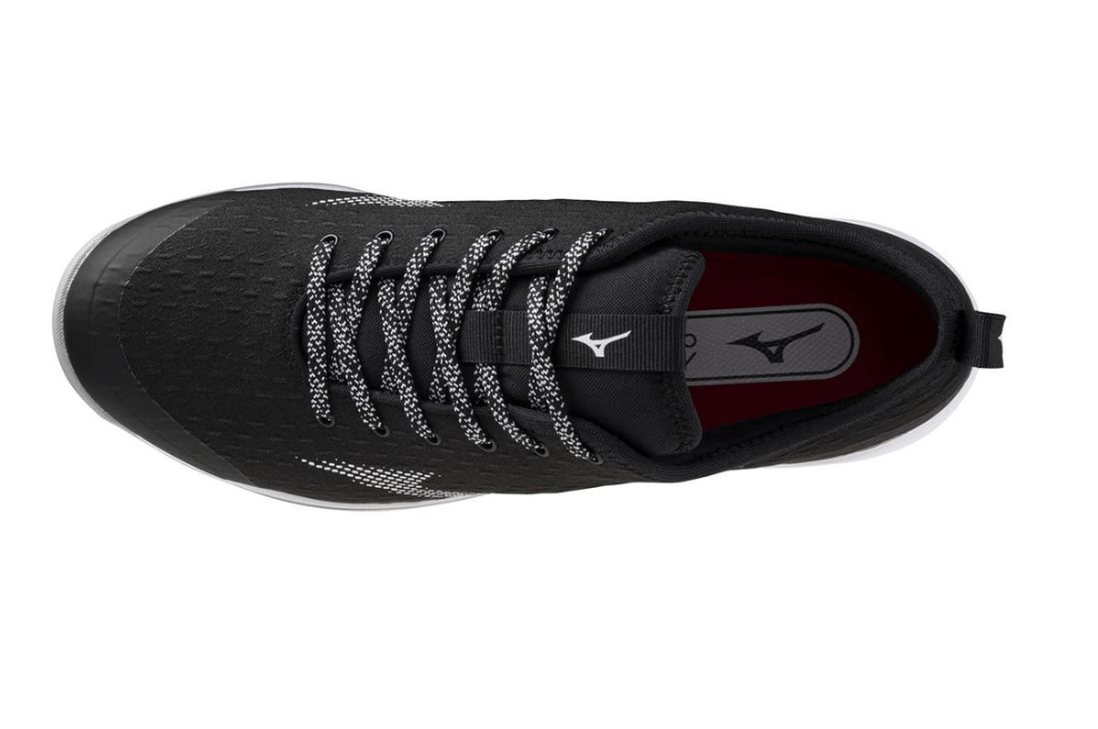 Top view of Mizuno Dominant4 Turf shoe featuring a breathable black upper and durable design for optimal comfort.