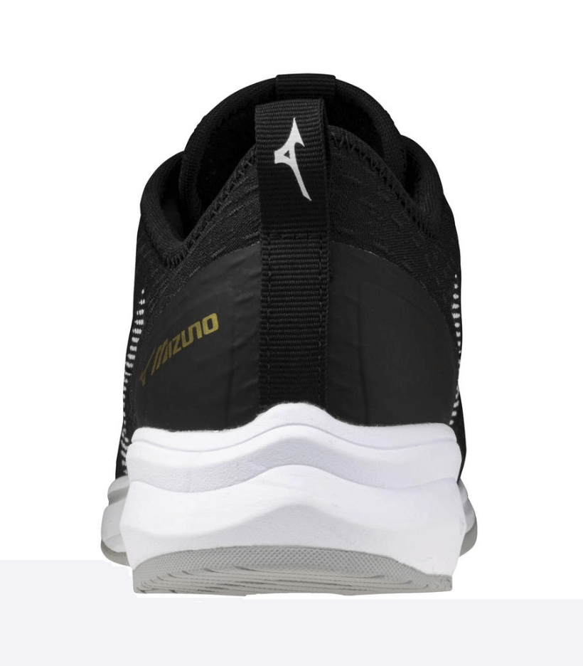 Back view of Mizuno Dominant4 Turf shoe featuring a lightweight, breathable design with Enerzy cushioning for comfort.
