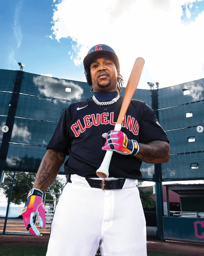 Franklin Jose Ramirez Limited Edition CFX Pro Youth gloves worn by MLB player holding bat, field background