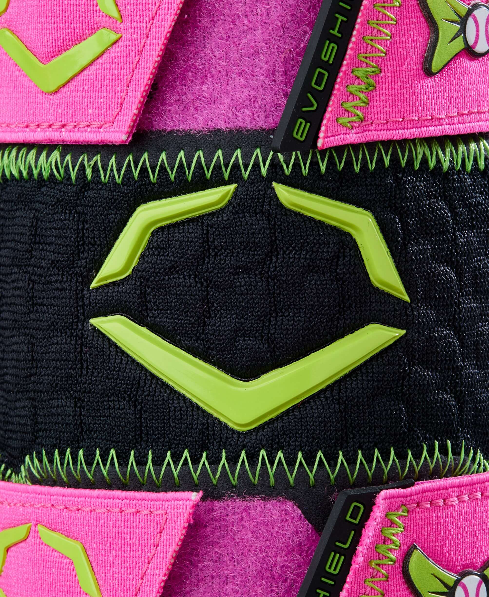 Close-up of Evoshield X-SRZ Party Animals Leg Guard featuring black, pink, and neon green design elements.