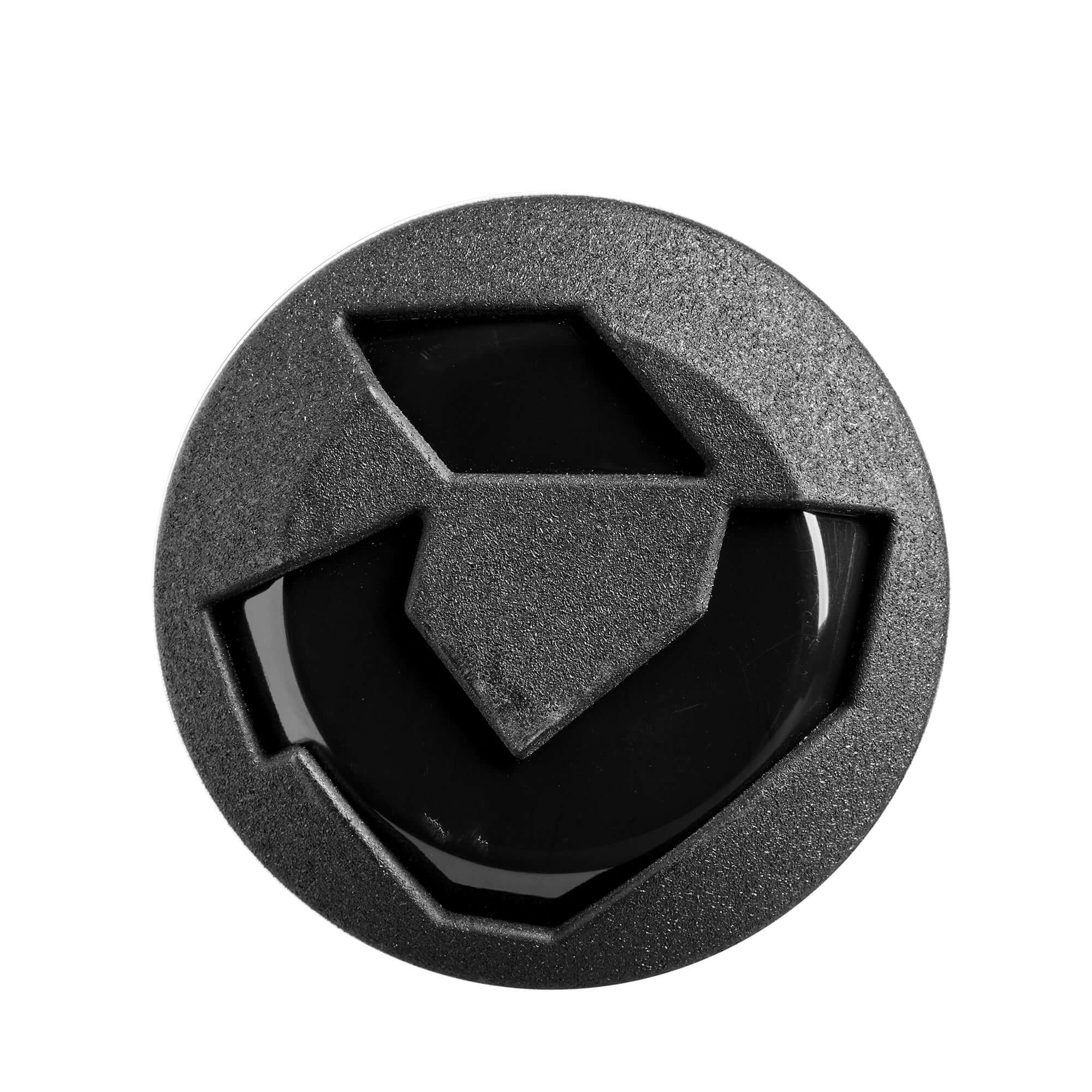 Top view of a black rubber bat grip cap featuring a geometric design, designed for enhancing bat handling.