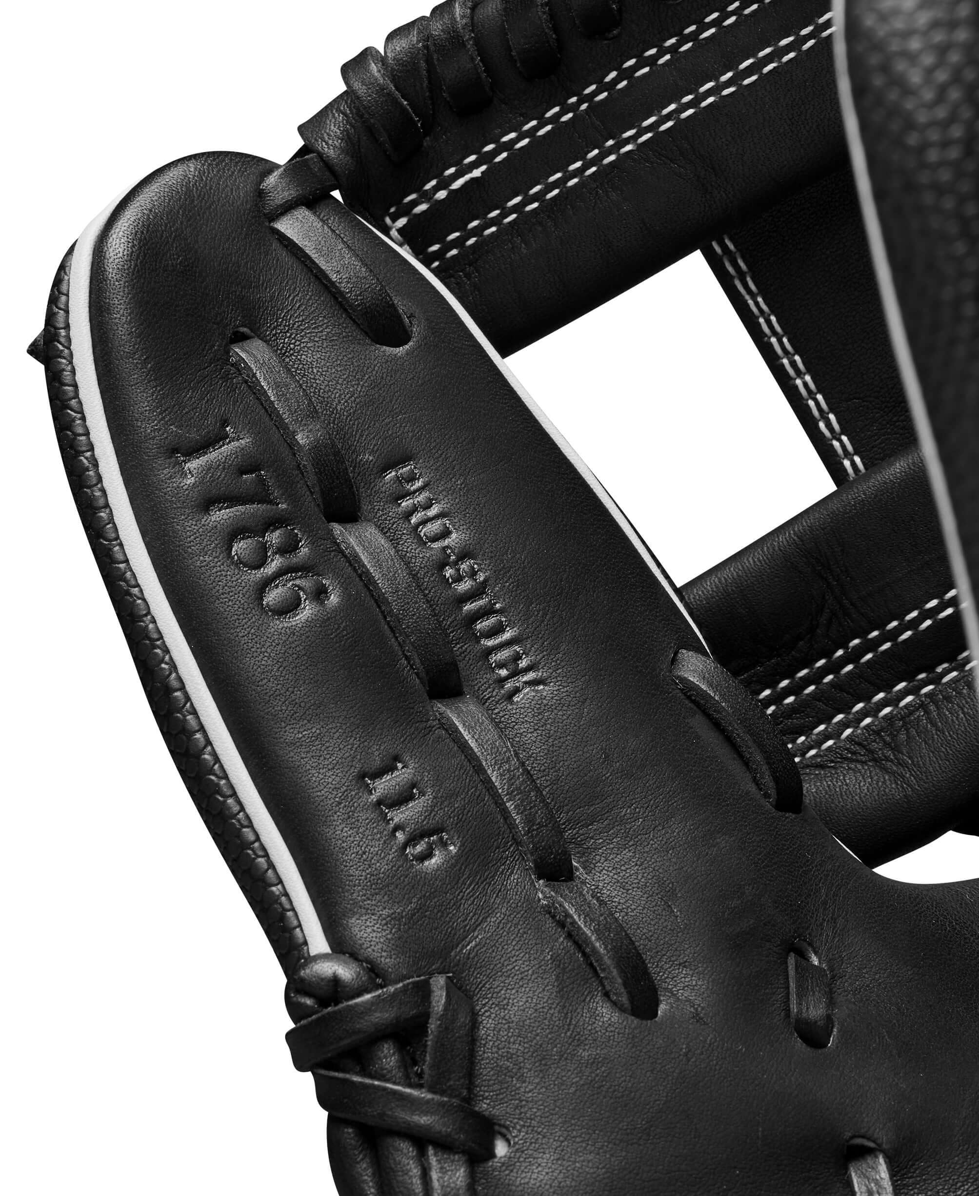 Interior view of Wilson 2024 A2000 1786SS black infield glove showing size and model details, featuring sleek design and durable materials.