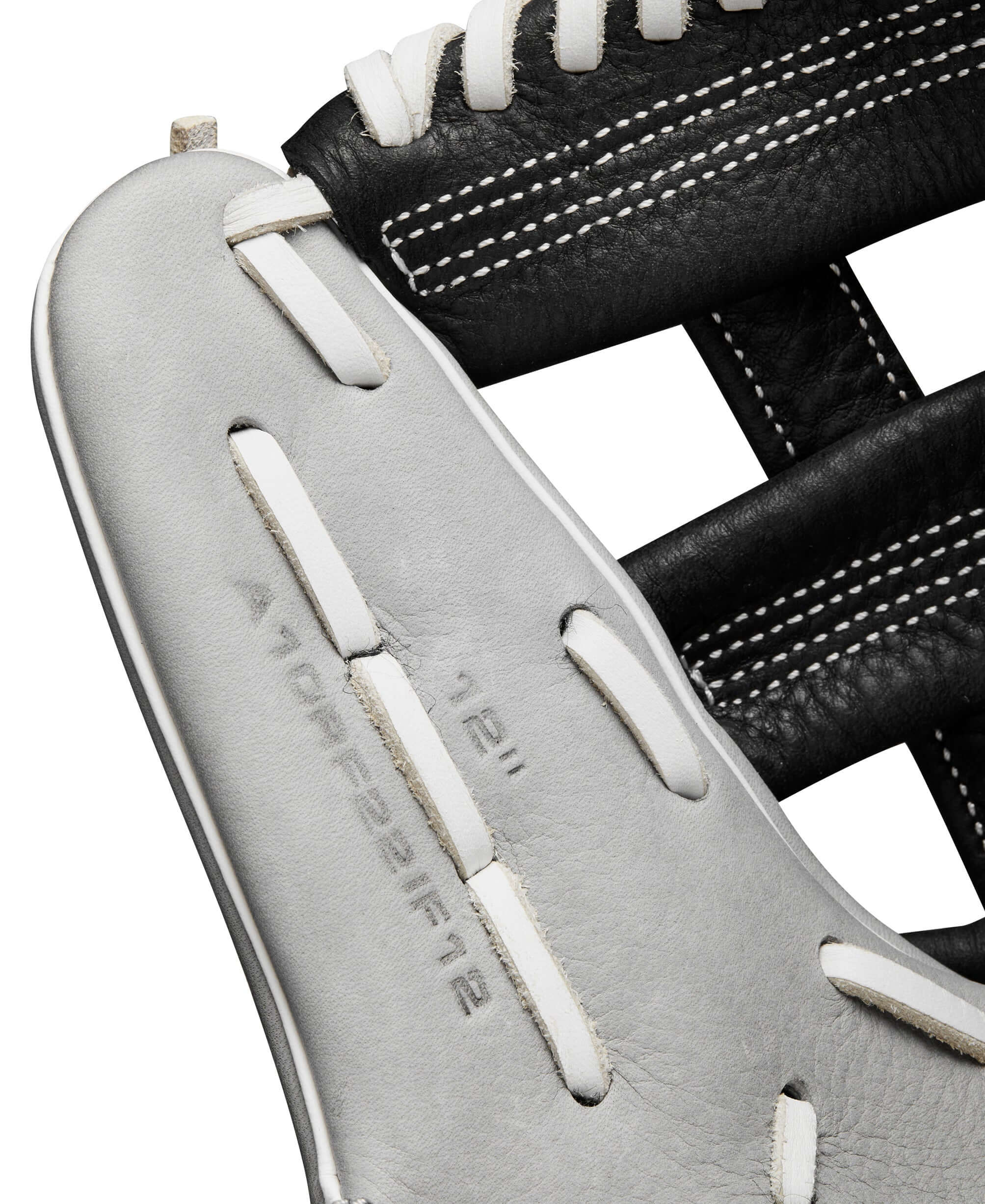Close-up of Wilson 2024 A1000 IF12 infield softball glove showing silver and black leather with stitching details.