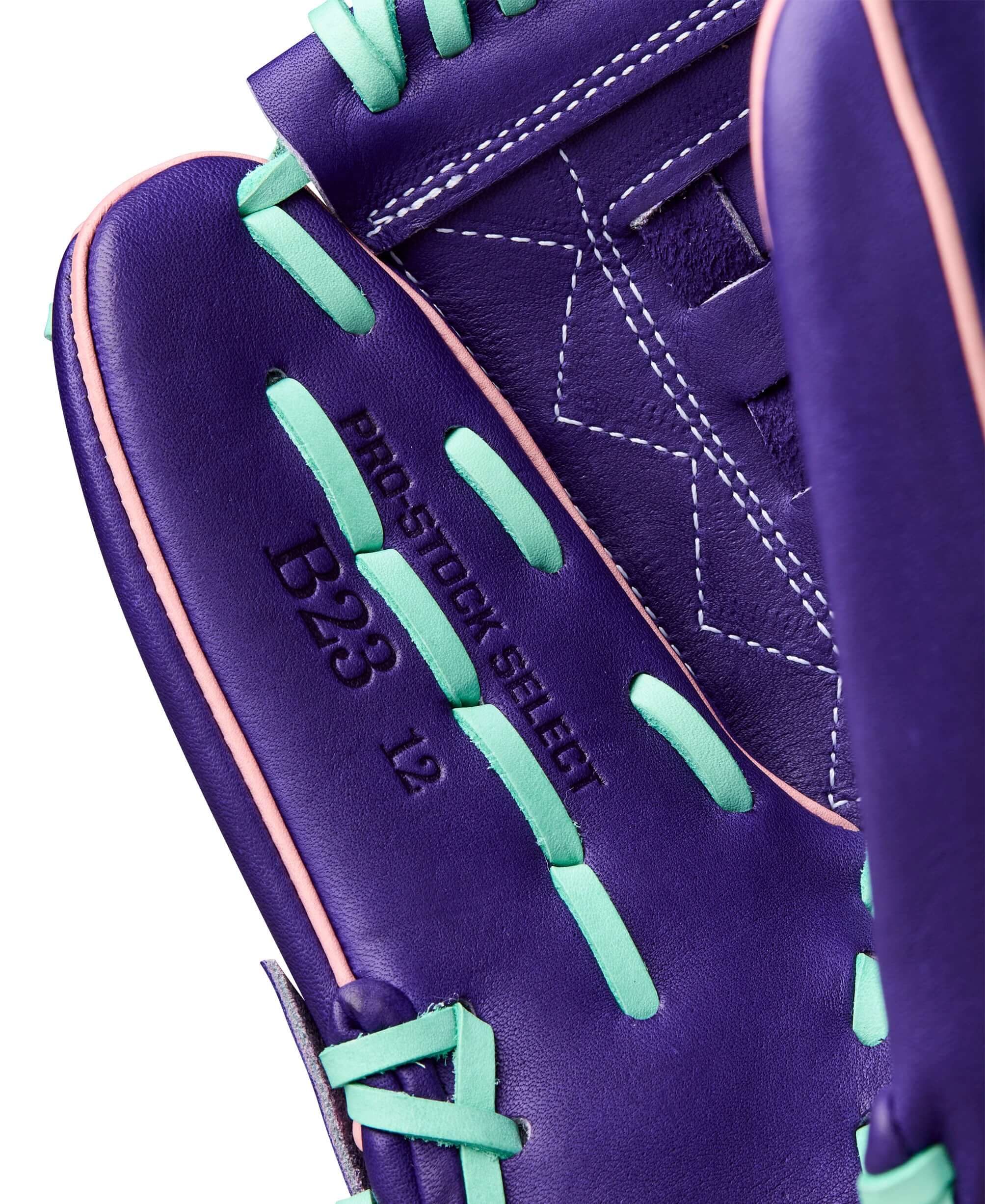 Wilson 2025 A2K C12 12” Pitcher’s Glove front thumb detail with stitching and Seafoam trim.