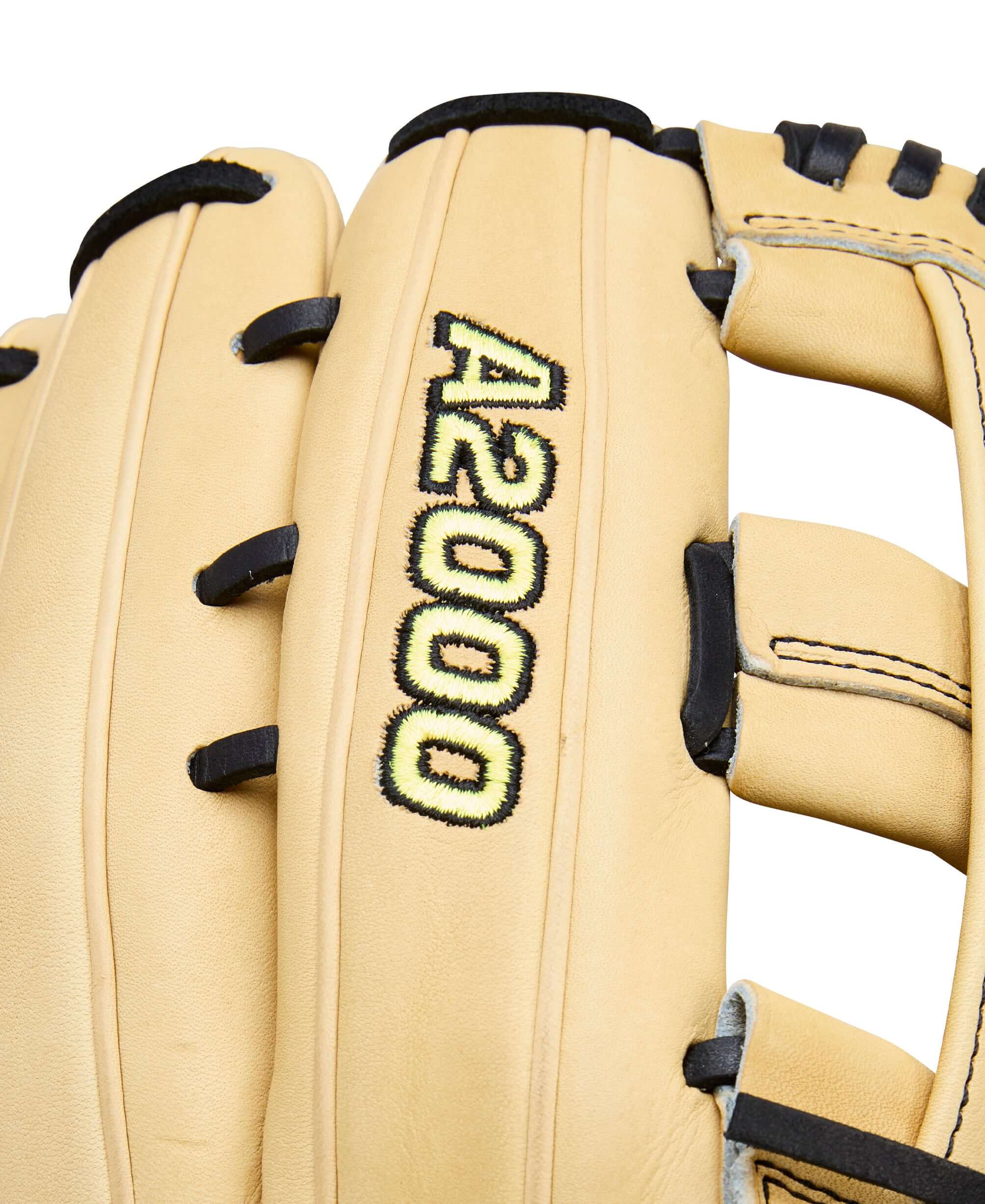 Close-up of 2026 Wilson A2000 Classic Series 1777 glove web detail with black lacing and stitching on blonde leather.
