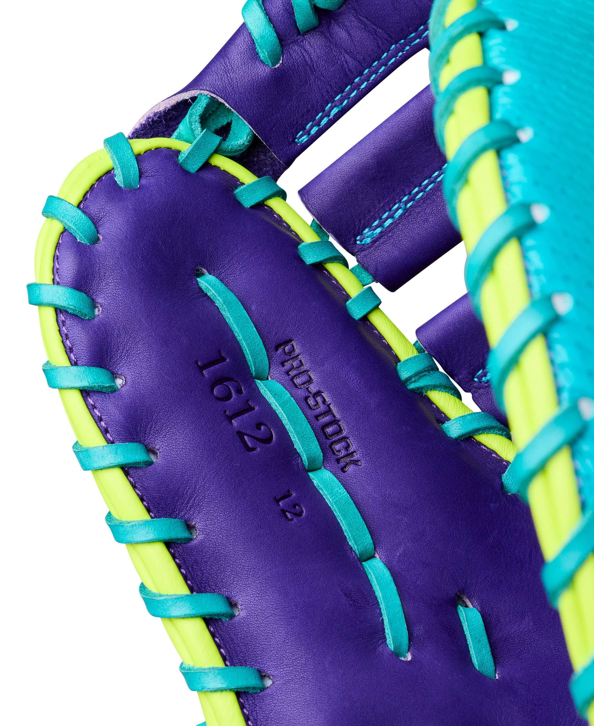 Close-up of Wilson Spring 2026 A2000 1612SS 12” Baseball First Base Mitt with turquoise lacing and embossed Pro Stock branding on purple leather.