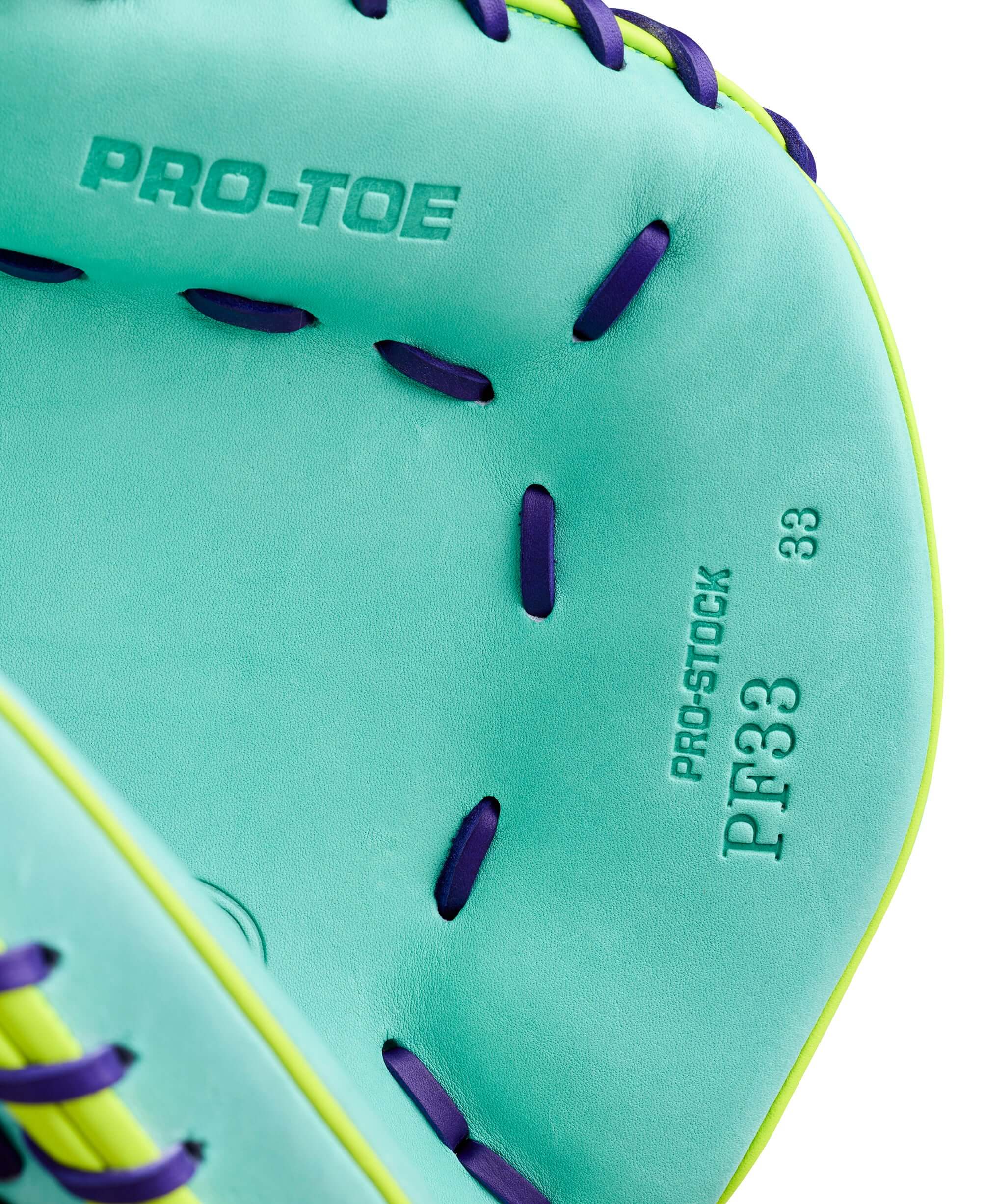 Close-up of Wilson Spring 2026 A2000 PF33SS 33” Baseball Catcher’s Mitt with Pro-Stock inscription and purple lacing detail.
