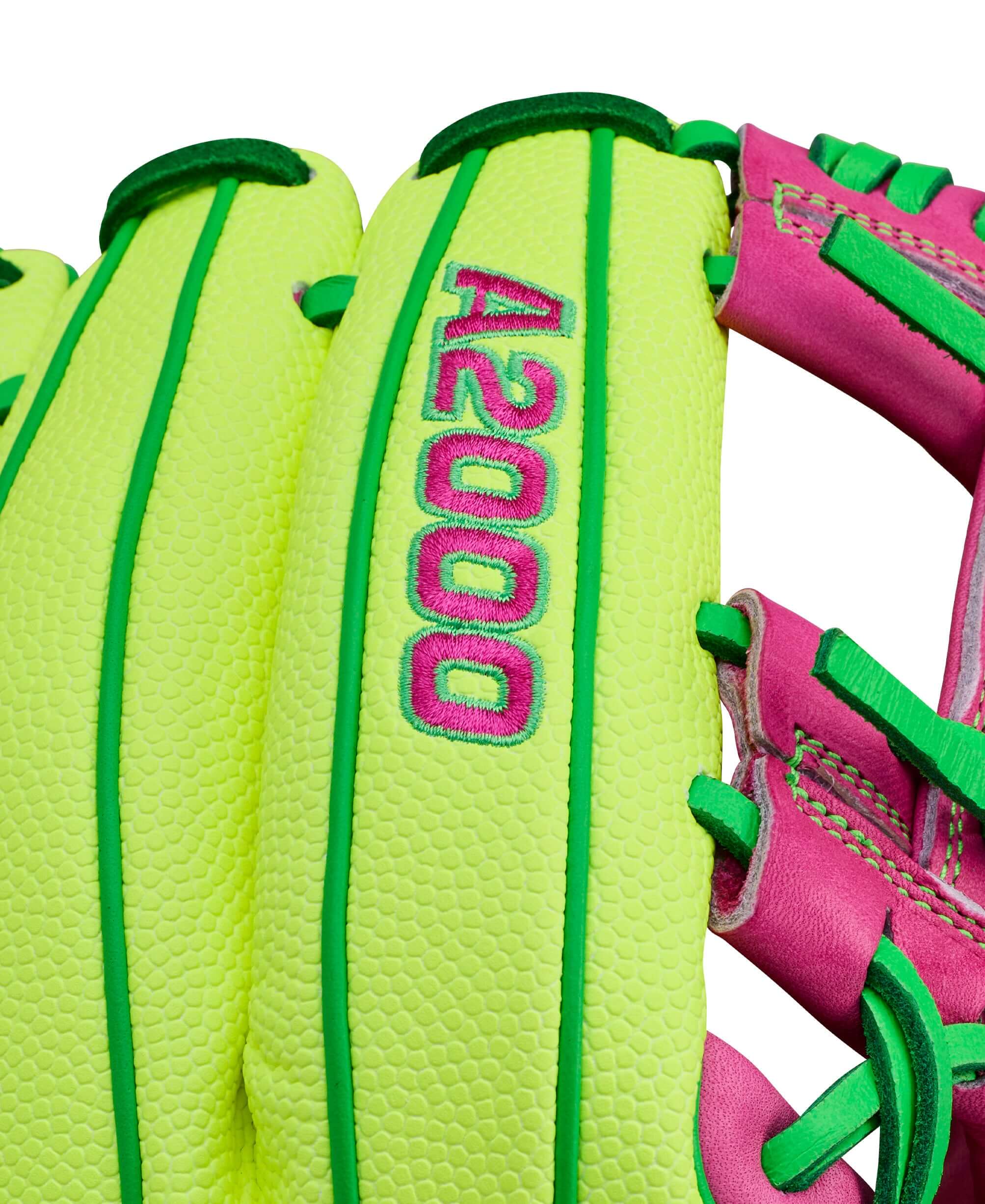 Wison A2000 March 2026 GOTM 1975SS Optic Yellow close-up of stitching and lacing detail with pink and green accents.