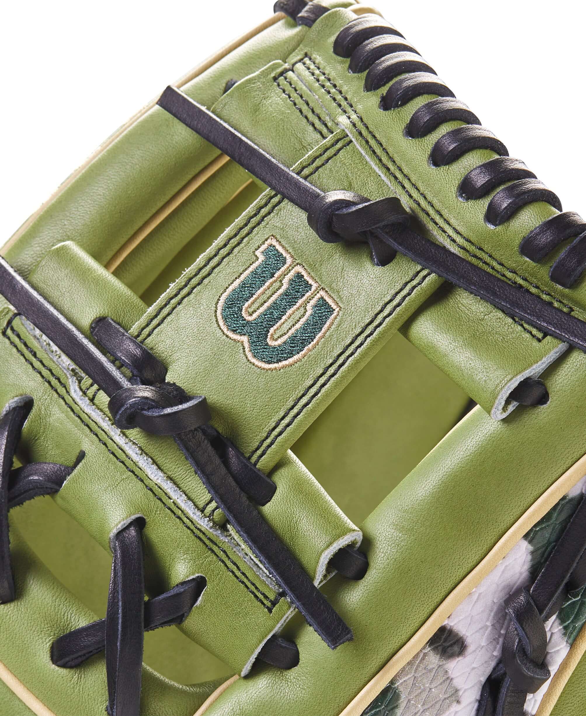 Close-up of Wilson A2000 glove showing Olive Green Pro Stock leather and H-Web design.