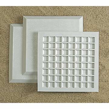 Three textured white trays with varied patterns arranged on a sandy surface, ideal for creative projects or decor.