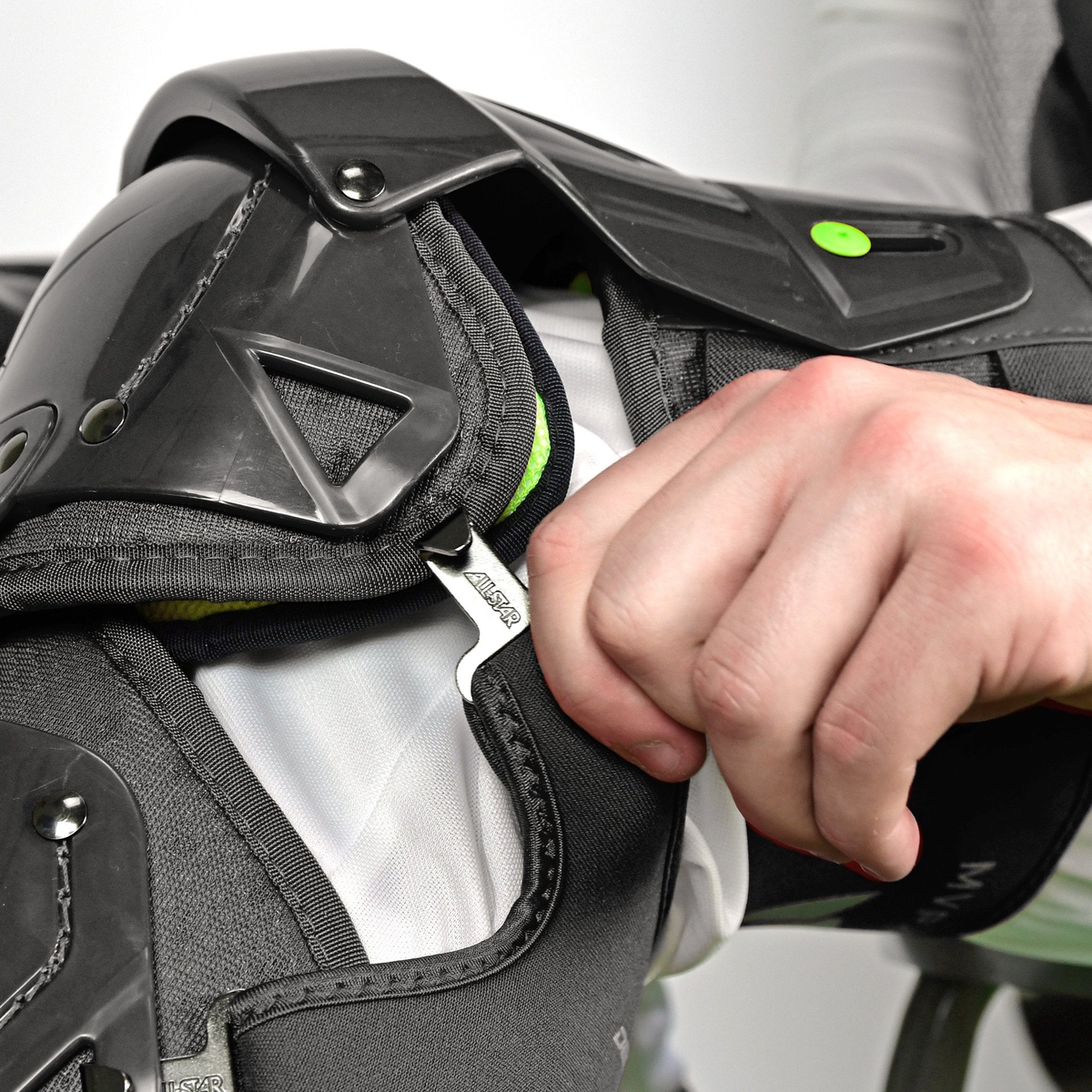 All-Star MVP-Pro leg guard CON4M integrated strap hook detail