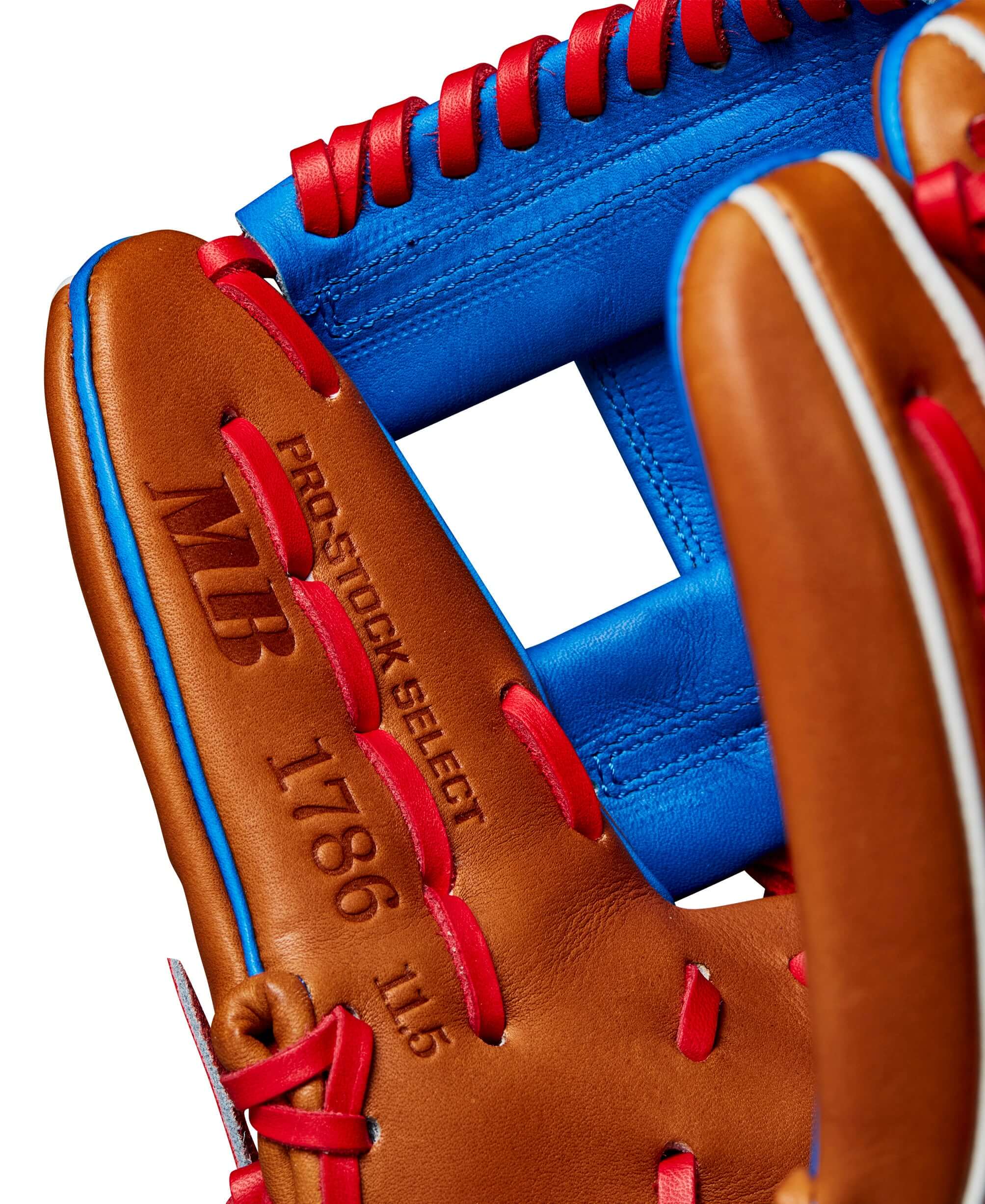 Close-up of Wilson A2K 1786 baseball glove showcasing Saddle Tan leather and blue accents, size 11.5".