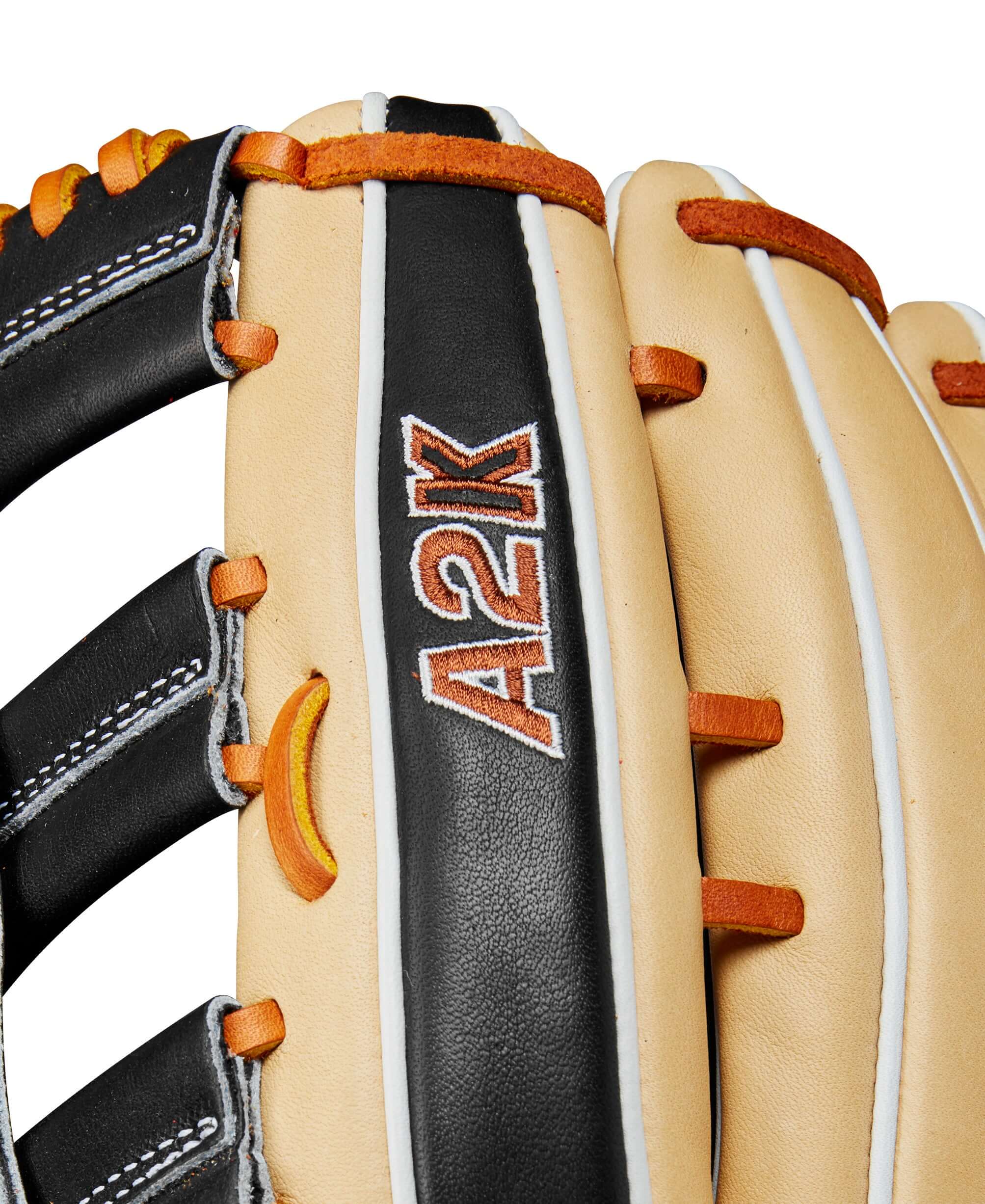 Close-up of Wilson A2K Outfield Baseball Glove showcasing black and blonde leather details and logo.