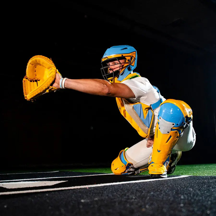 Catcher in action wearing All-Star MVP-Pro Short Fuse Catcher's Kit | Boston Limited Edition | Sky Blue/Yellow (Intermediate) with glove extended.