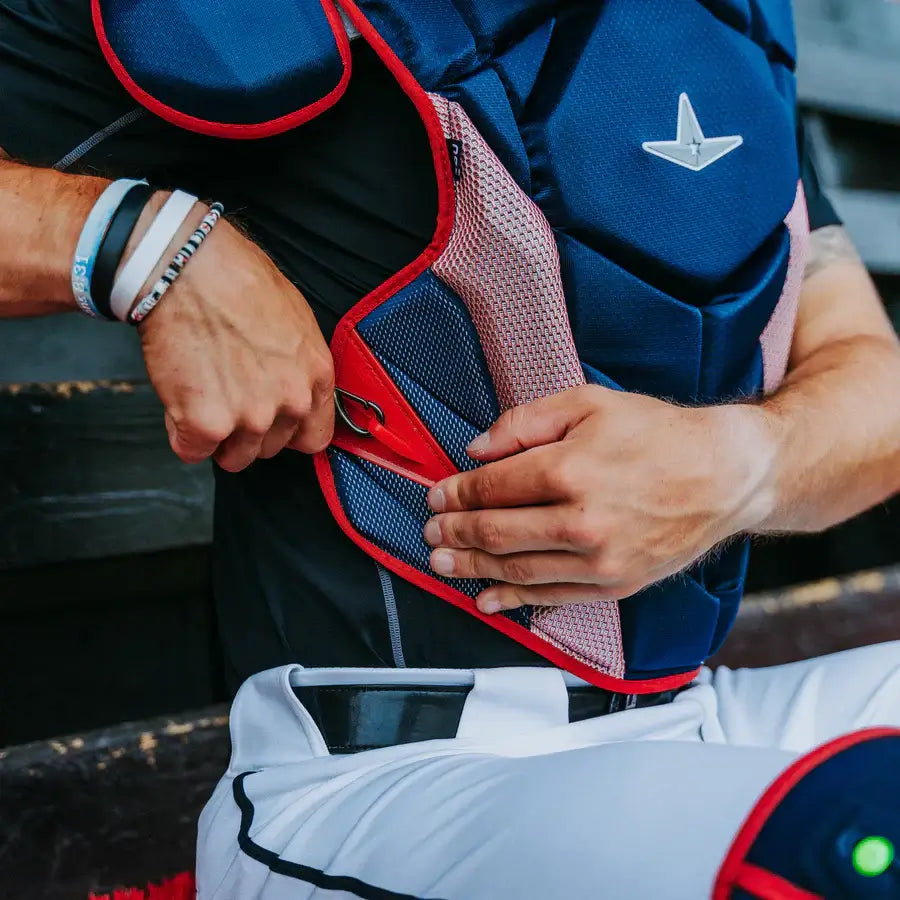 Adjusting All-Star MVP-PRO™ Chest Protector / NOCSAE / Small BK/BK with red strap detail on chest.