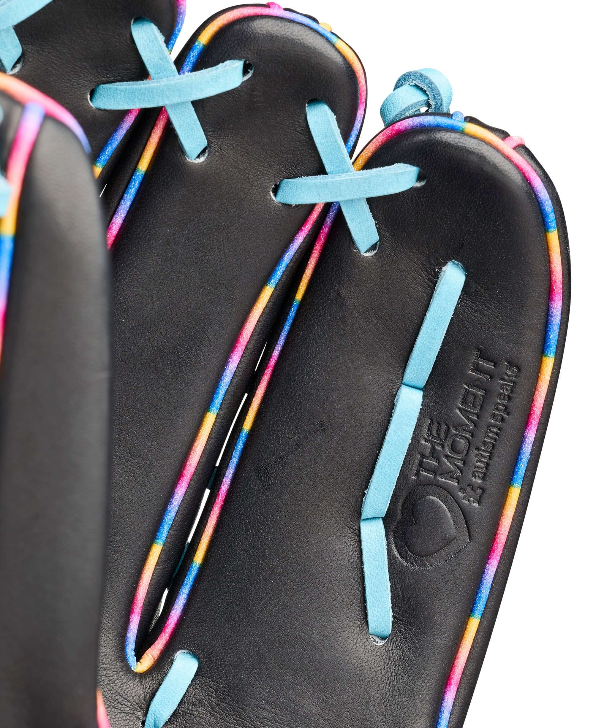 Interior view of Wilson 2026 Love the Moment 1750 12.5” outfield baseball glove showing black palm with multicolor lacing.