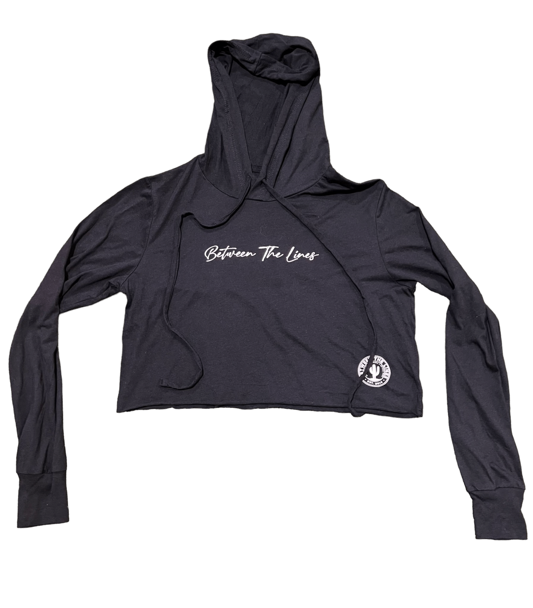 Between The Lines Women's Long Sleeve Hoodie Crop Top in black with drawstring, perfect for stylish layering and comfort.