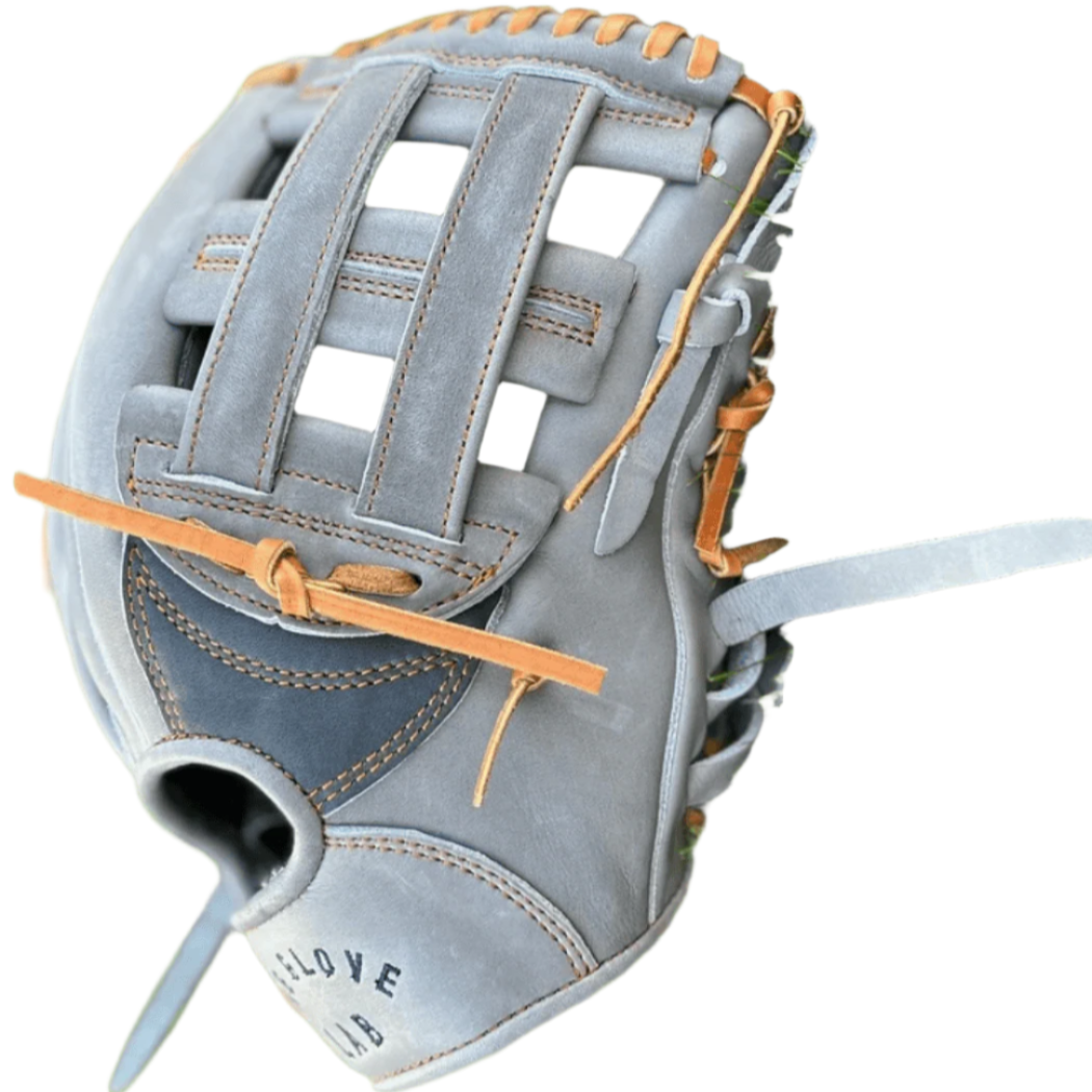 The Glove Lab 12-inch H-Webb glove in grey and navy on grass, showcasing premium Japanese tanned US Steerhide leather.