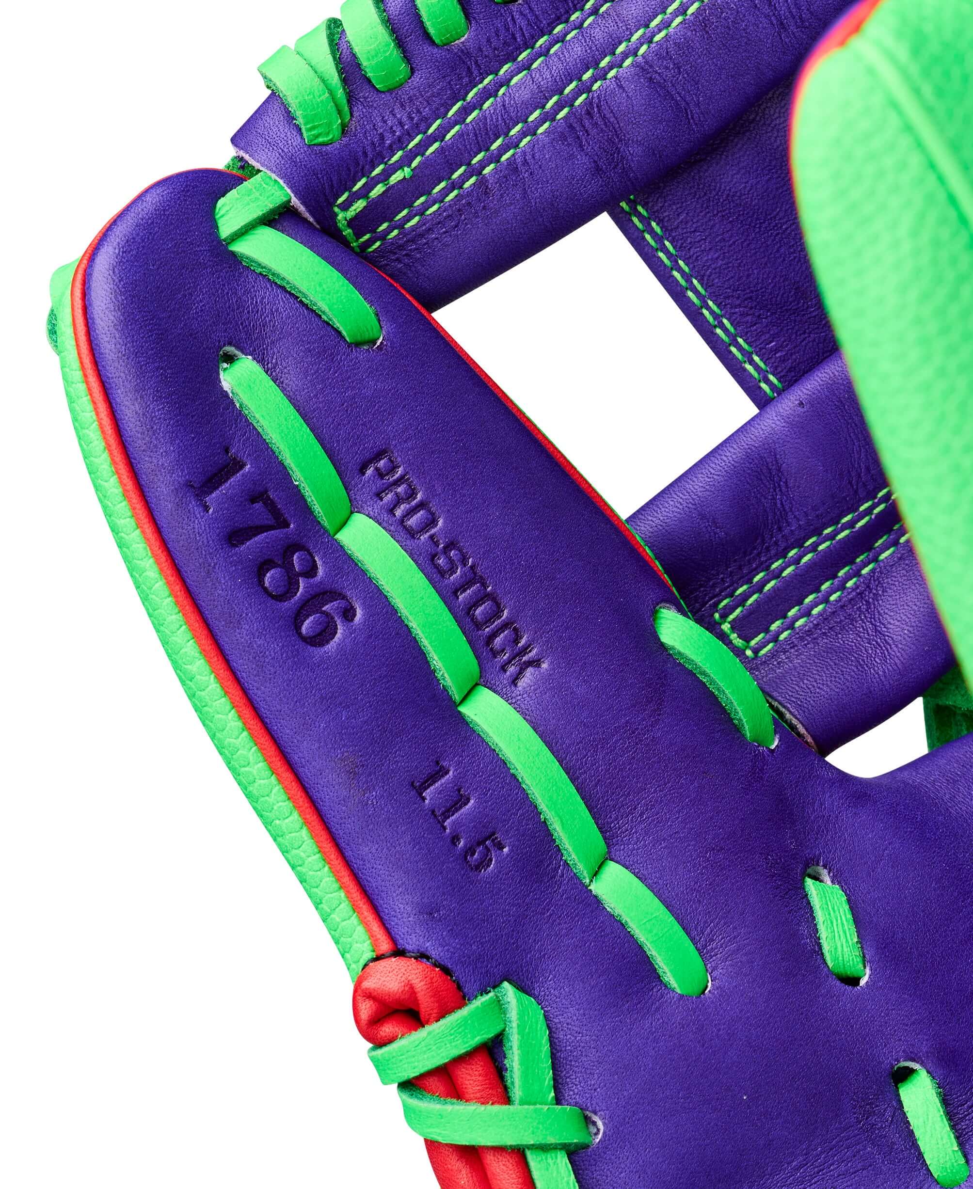 Close-up of Wilson Swingin’ Sour Apple A2000 1786 11.5" Infield Baseball Glove showing purple leather with green lacing and '1786' imprint.