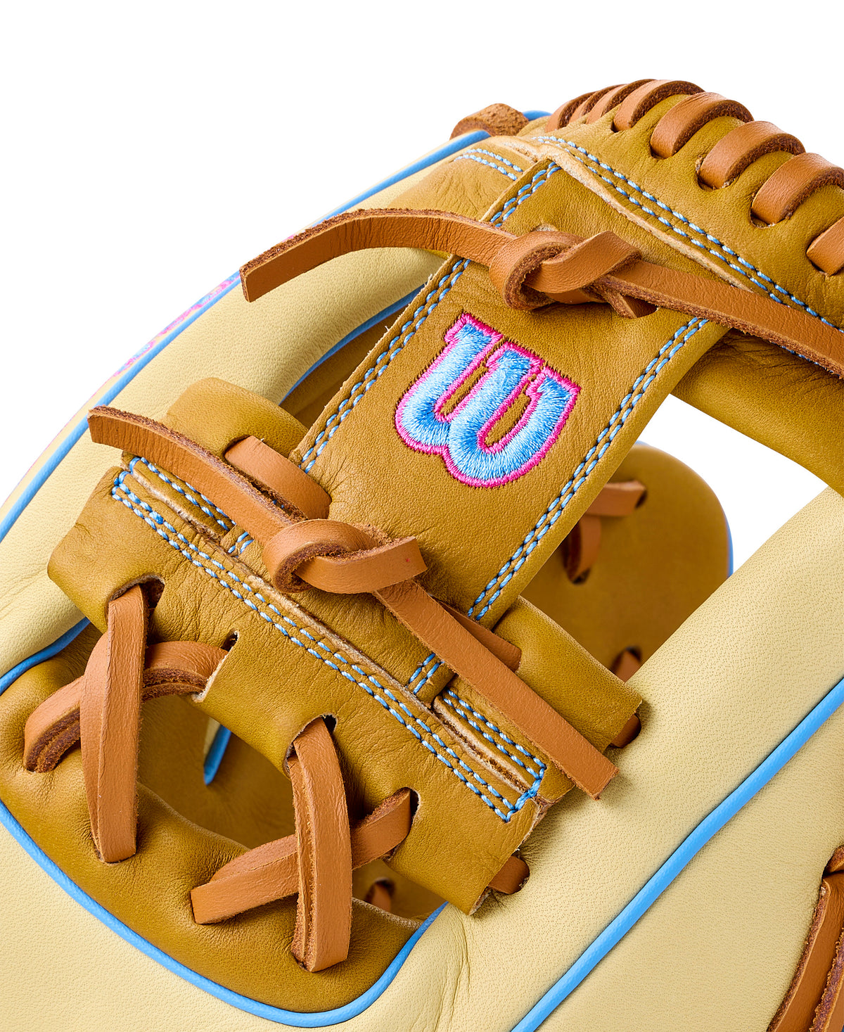 Close-up of Wilson 2027 A1000 1786 infield baseball glove with Saddle Tan, Blonde, and Cool Blue accents.