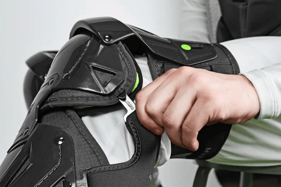 Adjusting strap on All-Star MVP-PRO™ Catcher Leg Guards | Black/Black | Small, showing hinge detail and padding