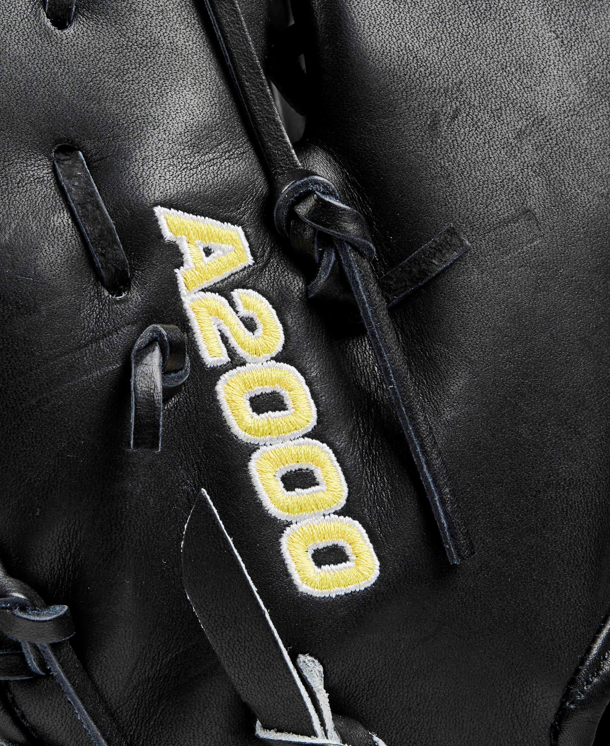 Wilson 2024 A2000 1679 Glove Day Black 12.5” mitt detail shot of bold Wilson A2000 logo.