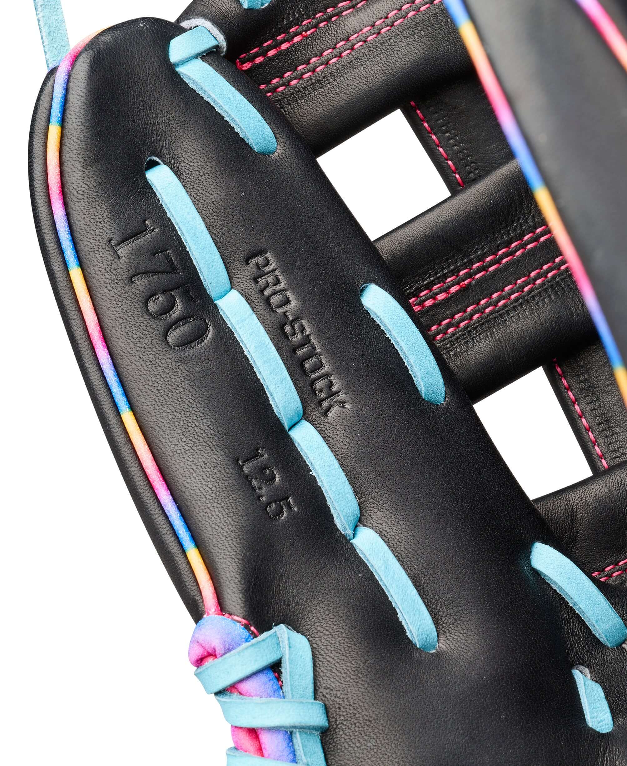 Web detail of Wilson 2026 Love the Moment 1750 12.5” Outfield Baseball Glove LHT with multicolor lacing and embossing, focus on stitching.