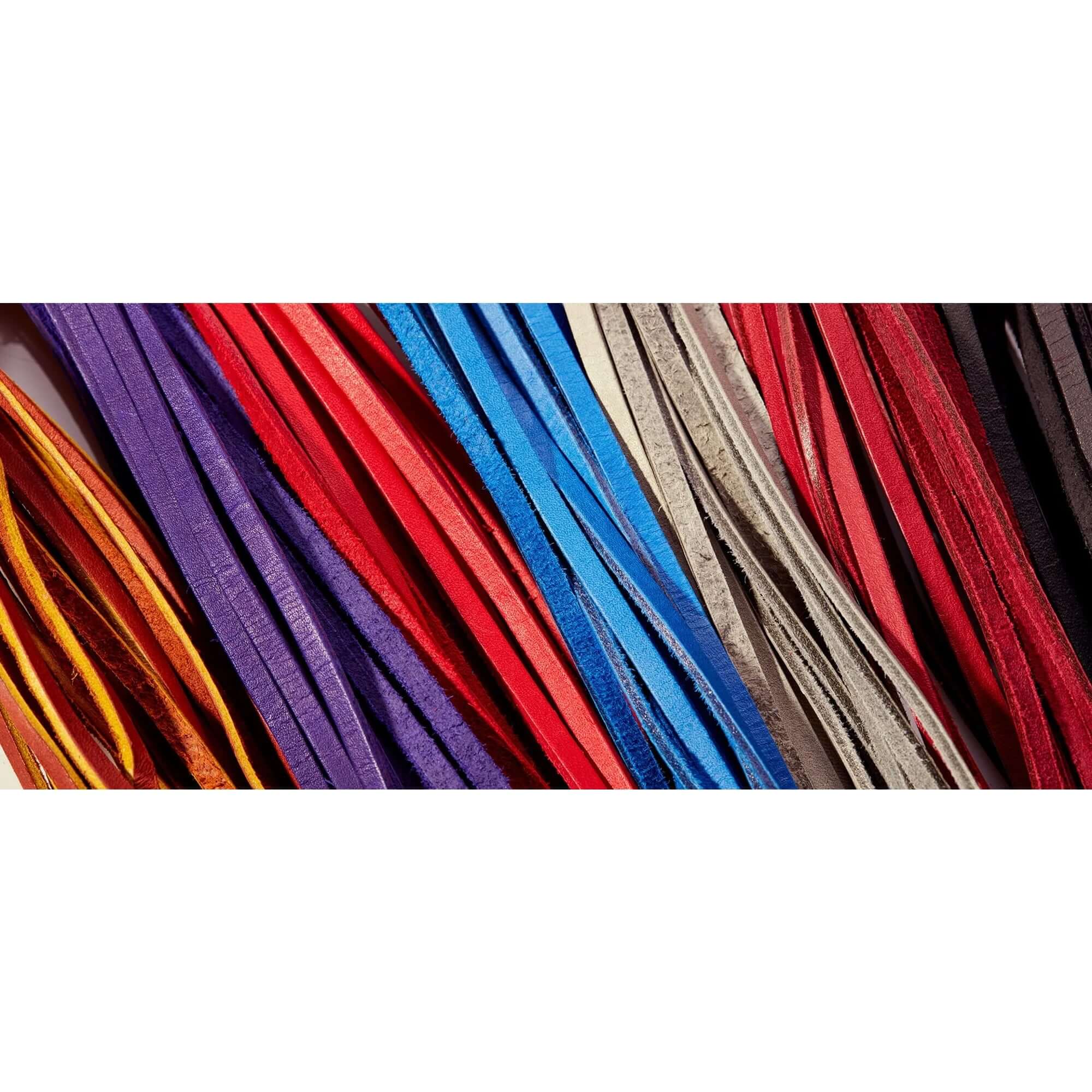 Colorful selection of Wilson Pro Stock lace in various hues including red, blue, purple, and tan, showcasing durability and softness.
